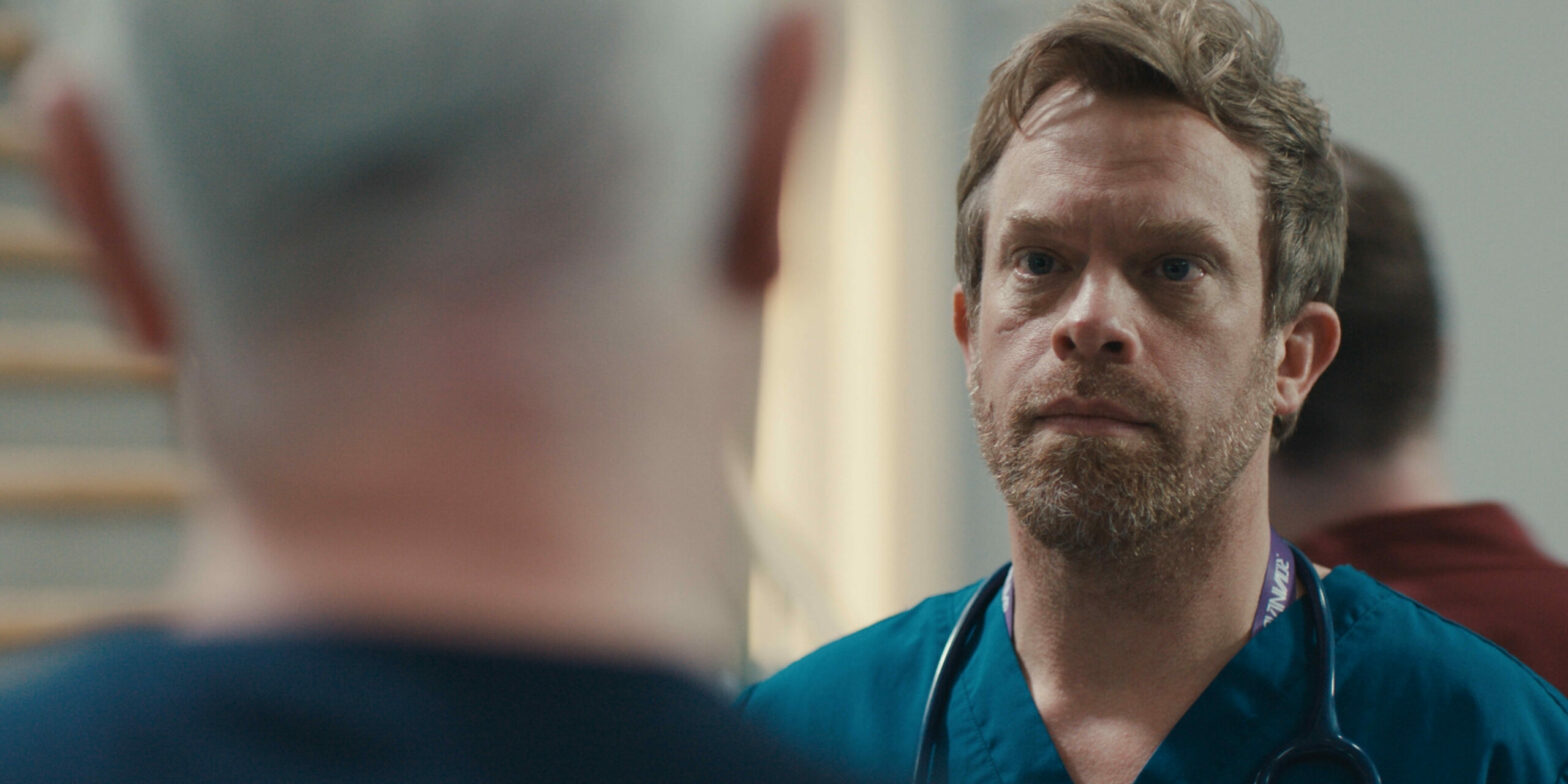 Casualty Dylan looks at Charlie seriously