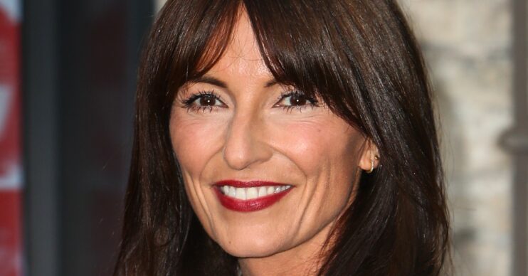 Davina McCall wearing red lipstick and smiling