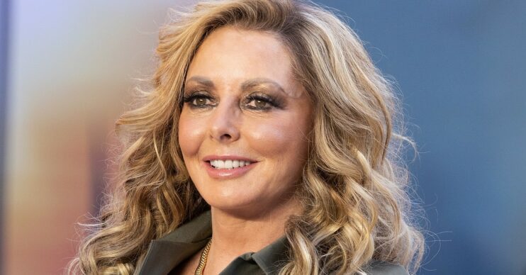 Carol Vorderman smiling at the Top Gun Premiere