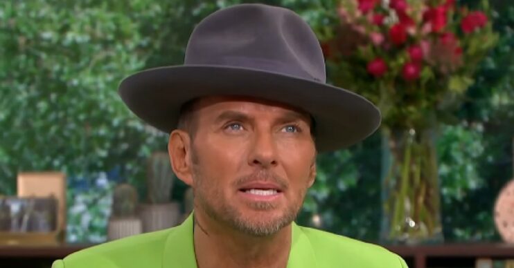 Matt Goss looking up while wearing a hat on This Morning today