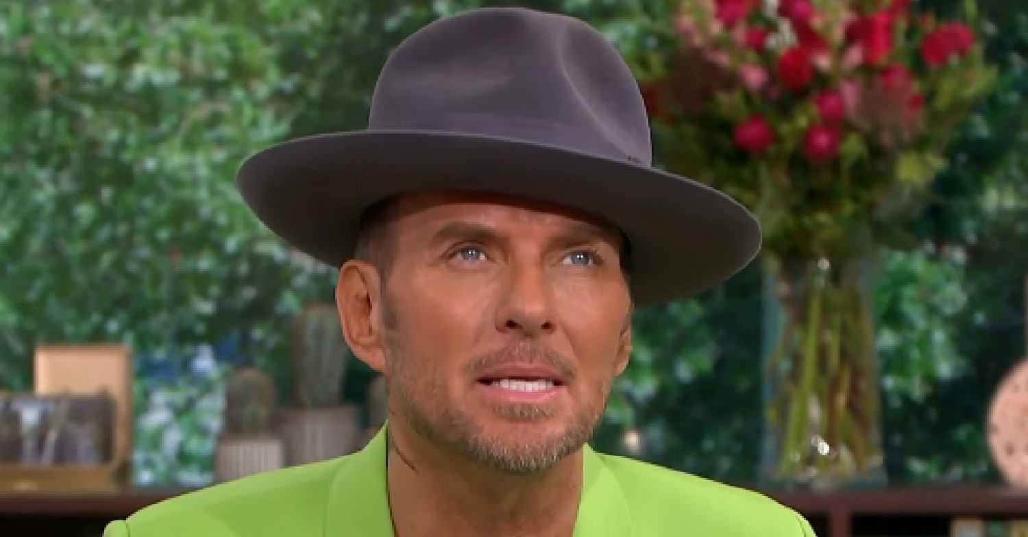 Matt Goss looking up while wearing a hat on This Morning today