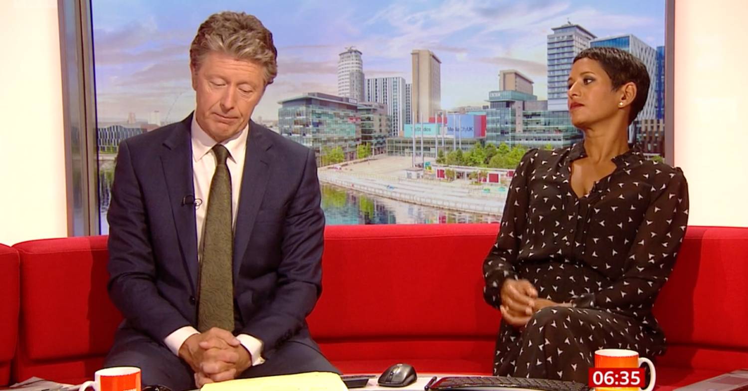 Naga Munchetty pulls back in her seat and Charlie Stayt looks down on BBC Breakfast