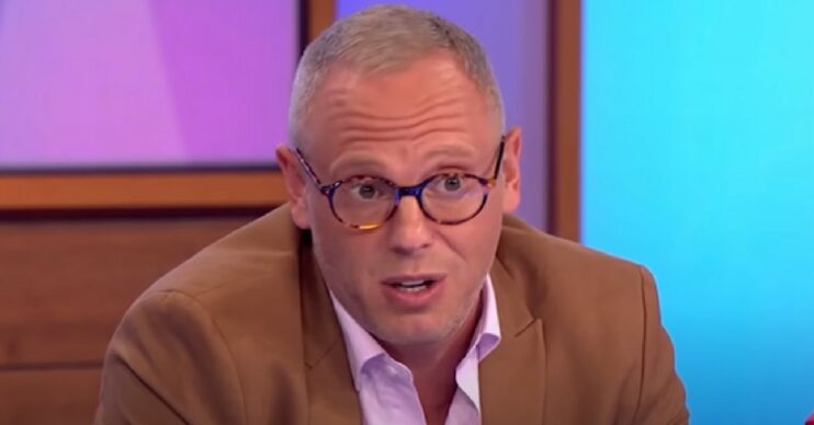 Robert Rinder wearing glasses and blazer while talking on Loose Women