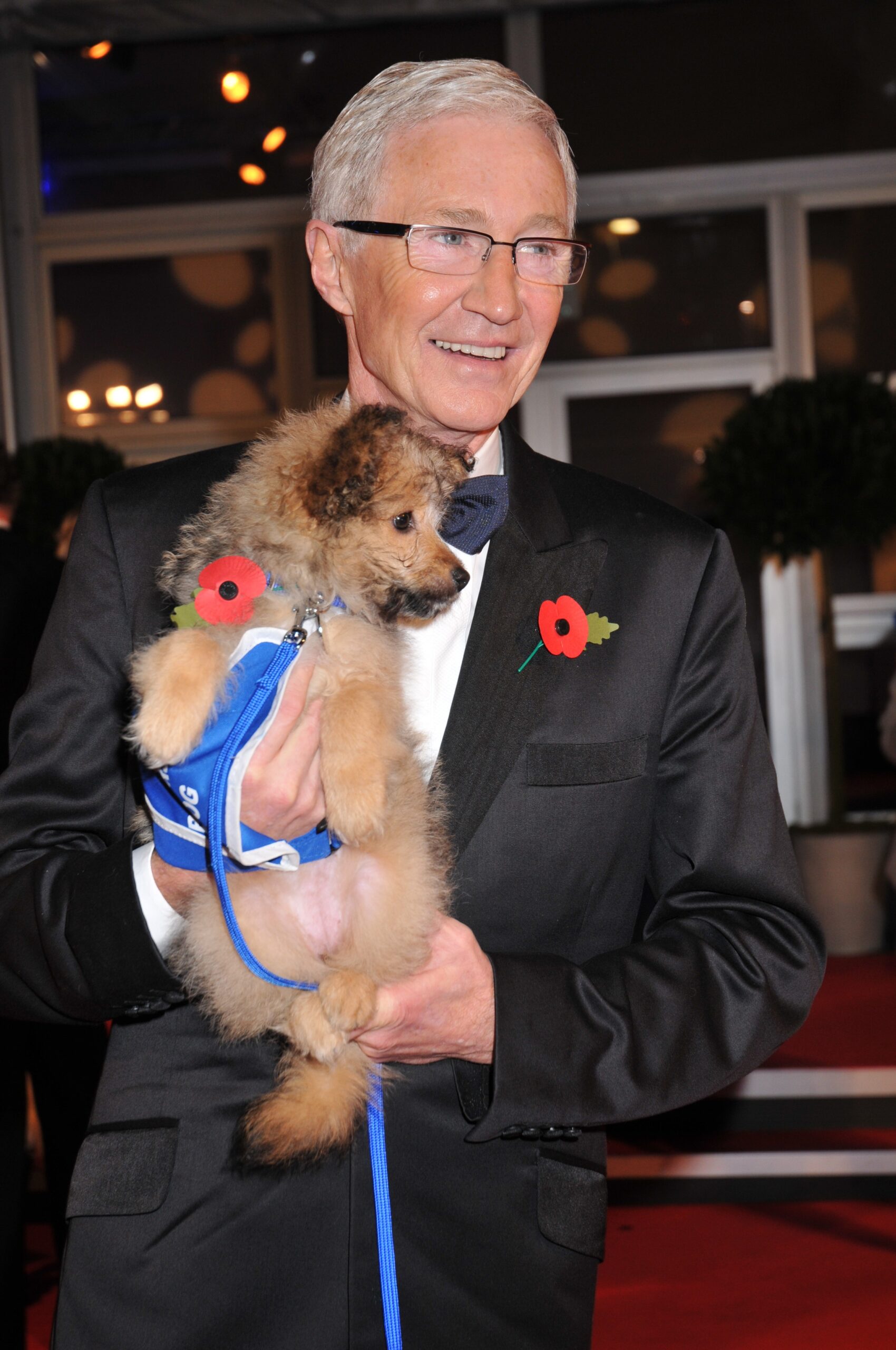 TV presenter Paul O'Grady wearing a suit