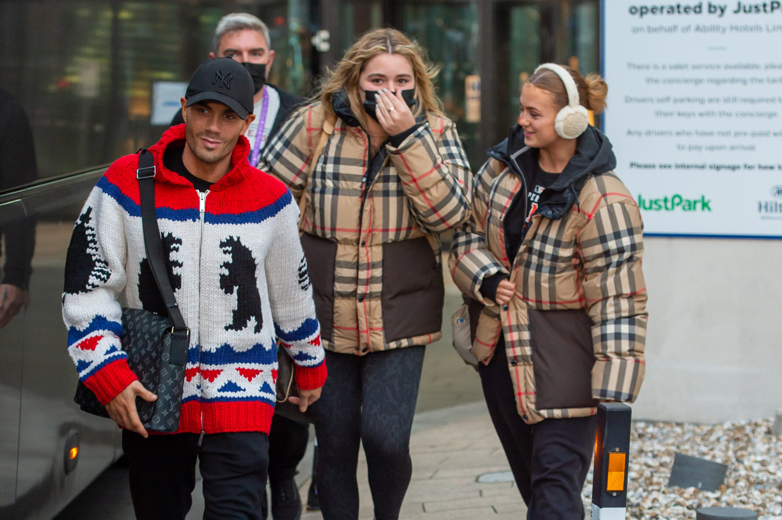 Max George and Maisie Smith walk together with a friend. 