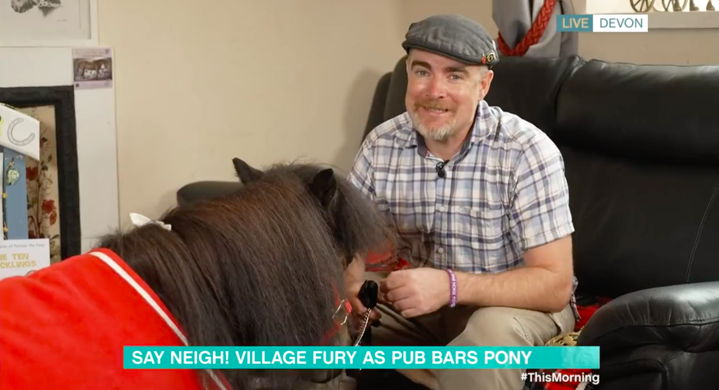 Owner Kirk Petrakis sits with Patrick the Pony while he sings a song on This Morning today