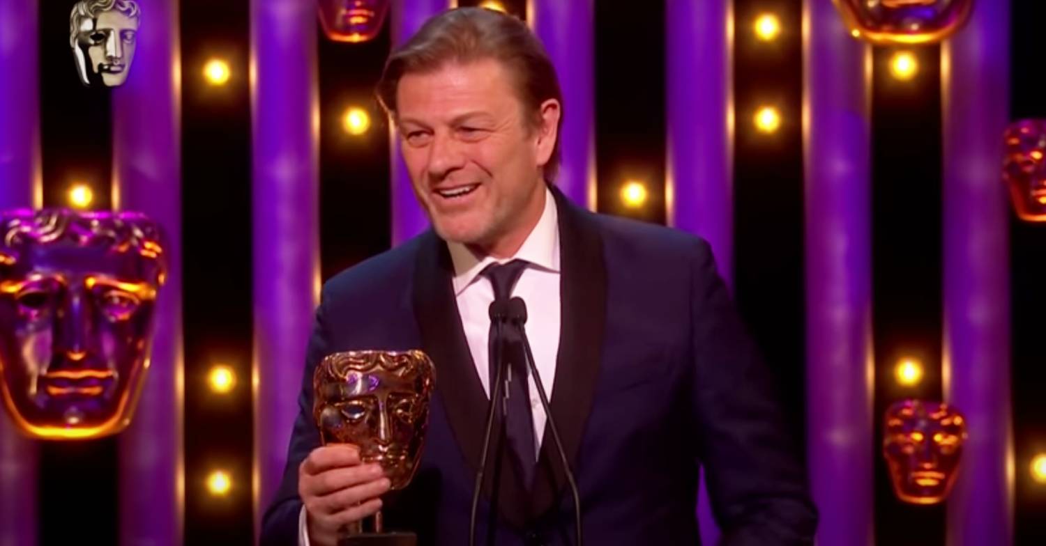 Sean Bean holds his trophy during his BAFTA win in 2018