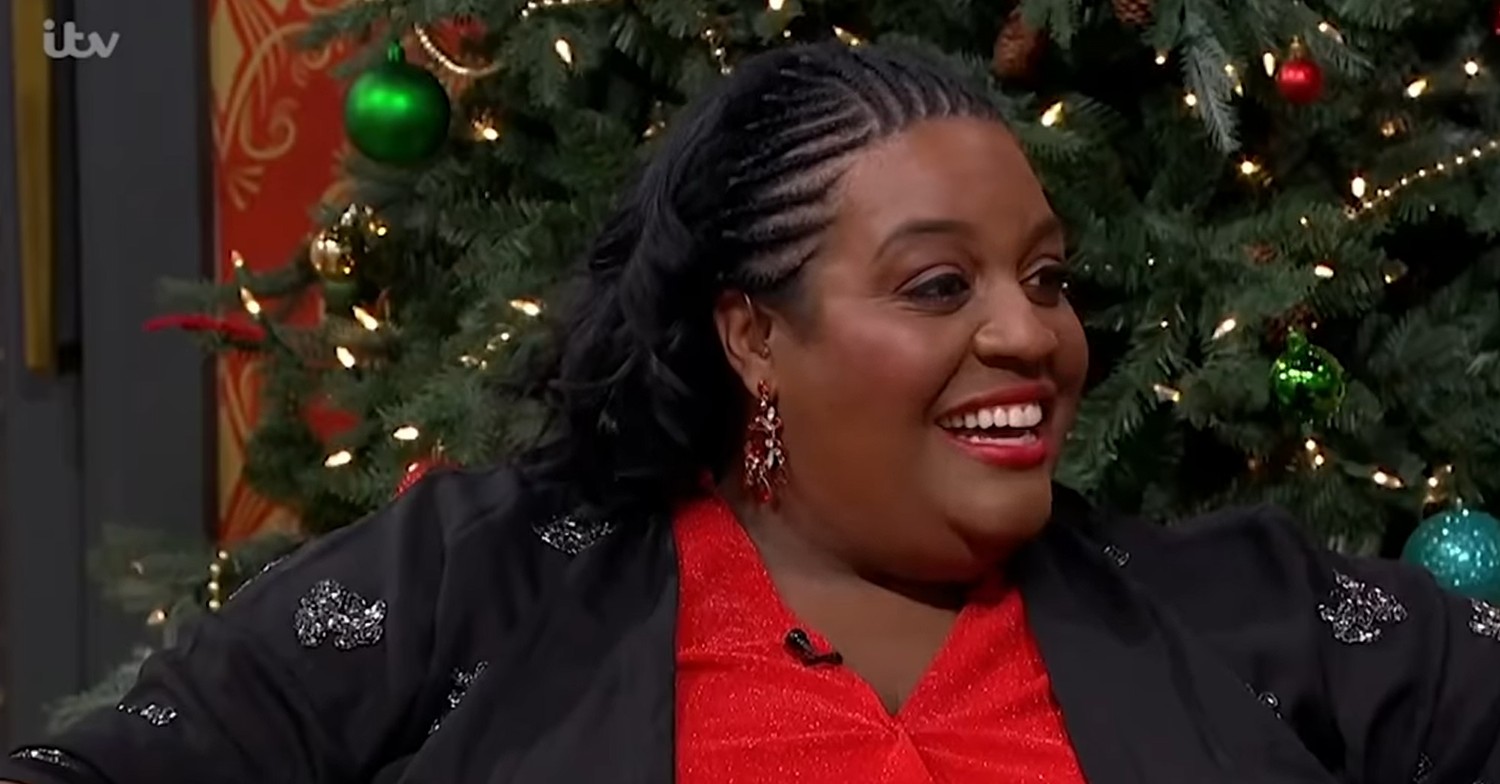 Alison Hammond smiling in front of Christmas tree on This Morning