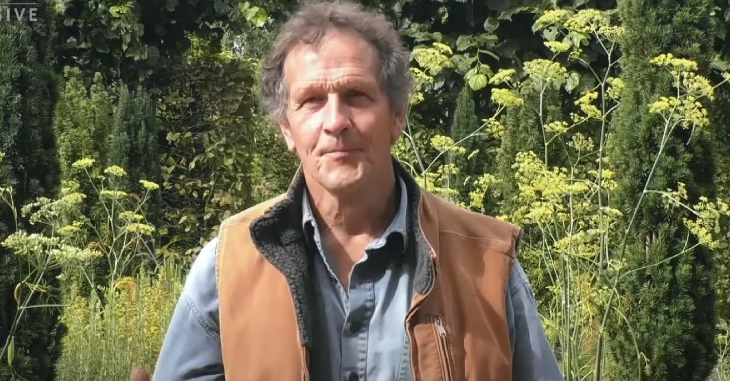 Monty Don smiling in his garden