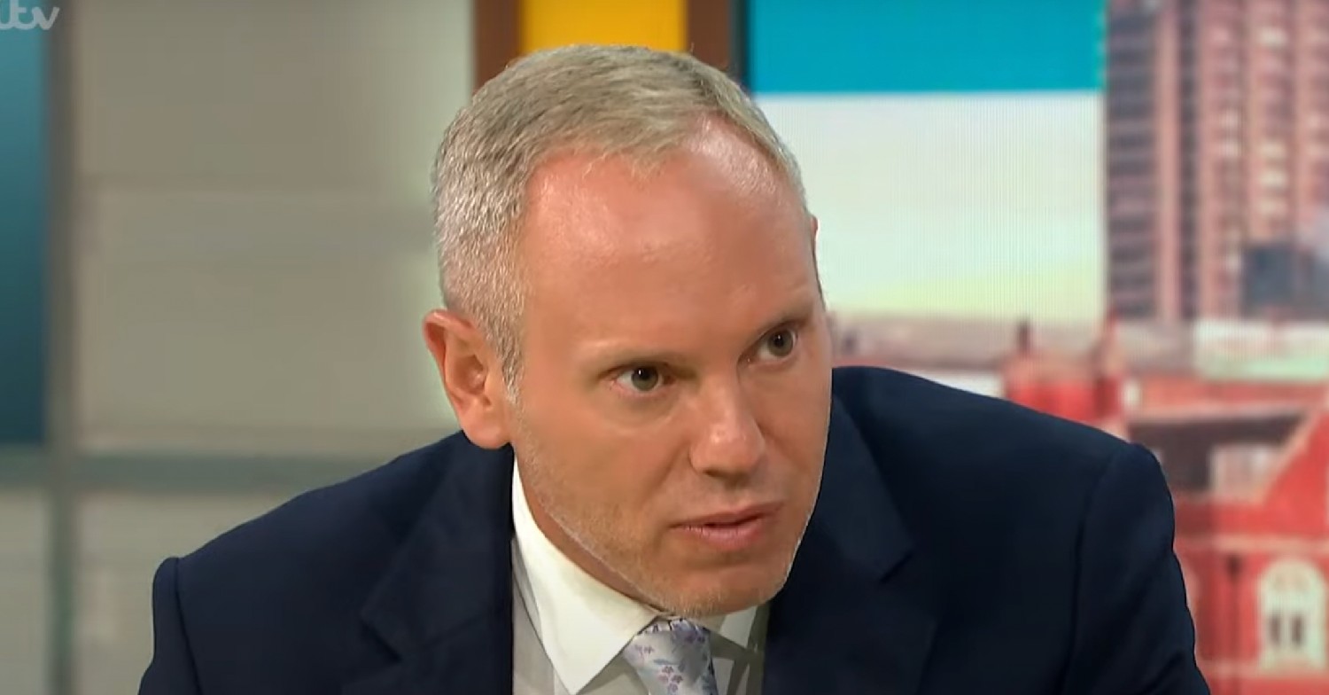 Rob Rinder looking serious at guest on GMB today