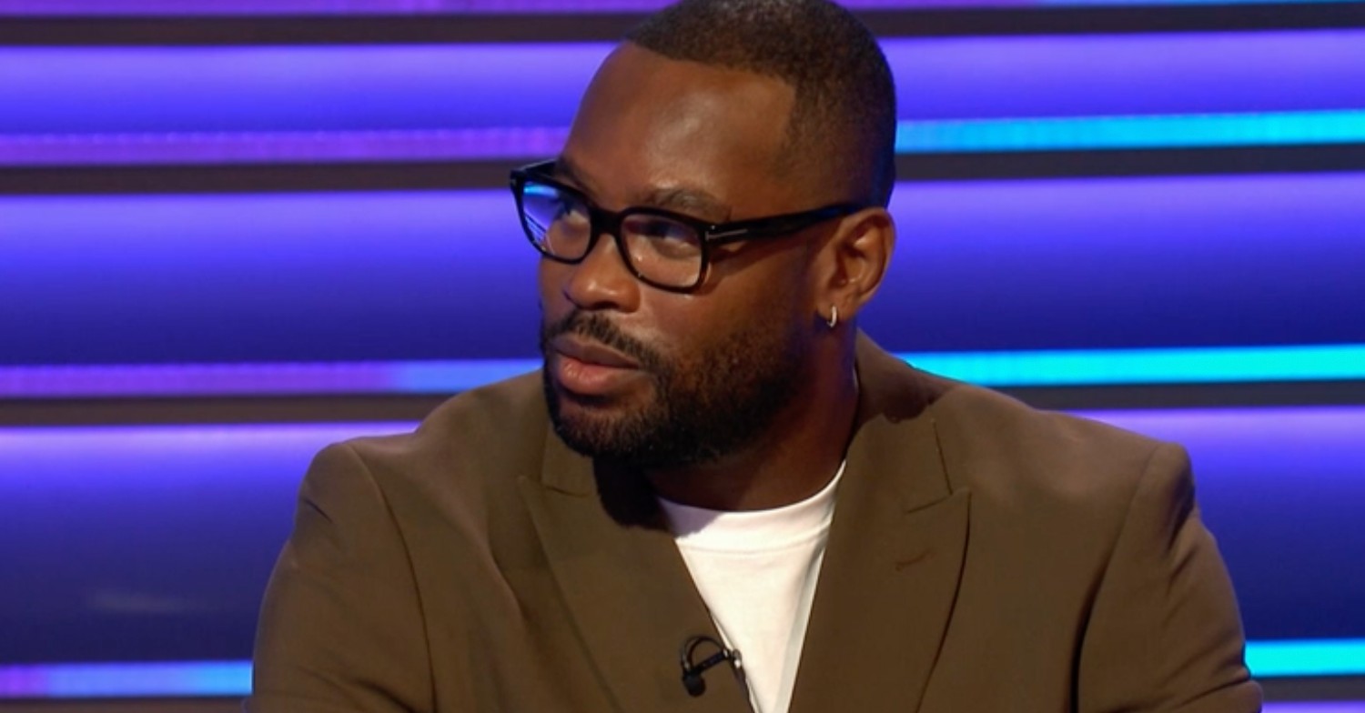 Ugo Monye on BBC Question of Sport wearing glasses and a brown suit