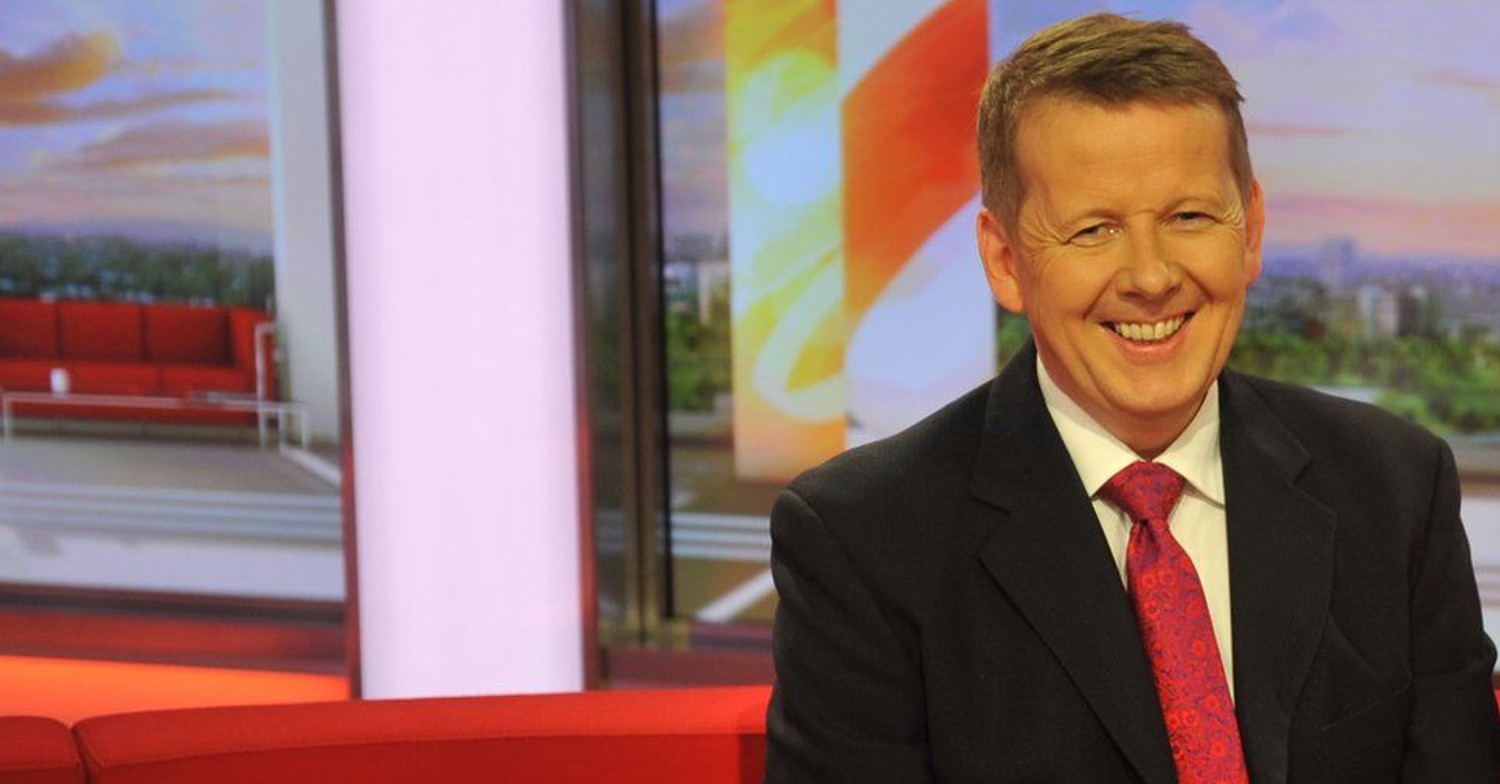 Late BBC Breakfast presenter Bill Turnbull smiling on the red sofa