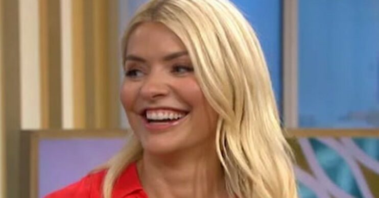 Holly Willoughby with longer hair on This Morning, smiling wearing red