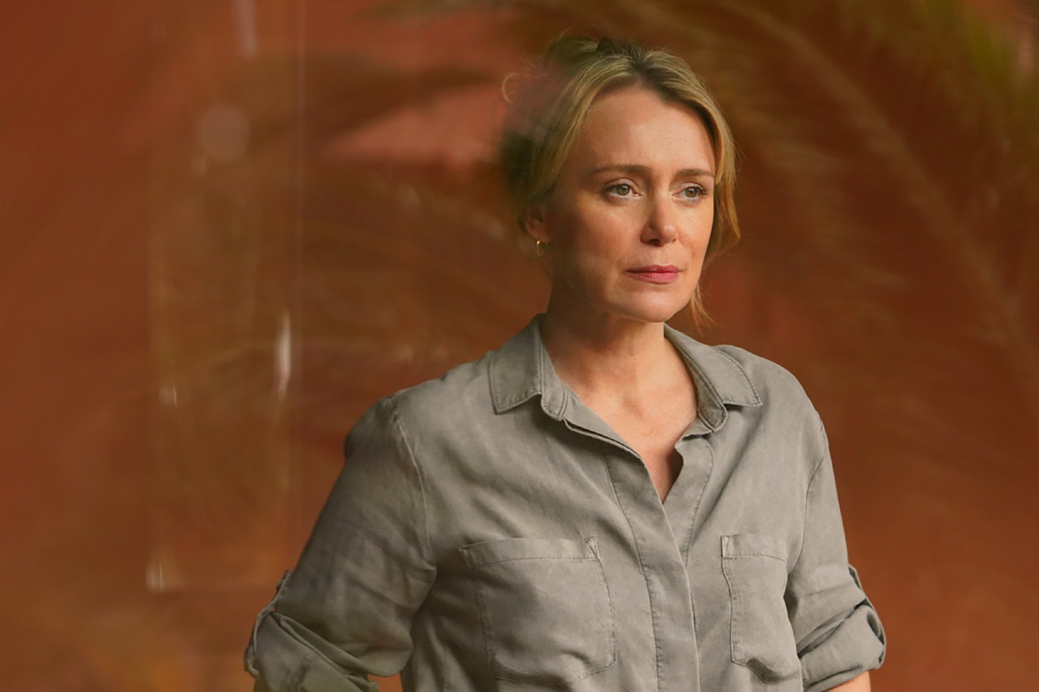 Keeley Hawes looking out of a window in Crossfire