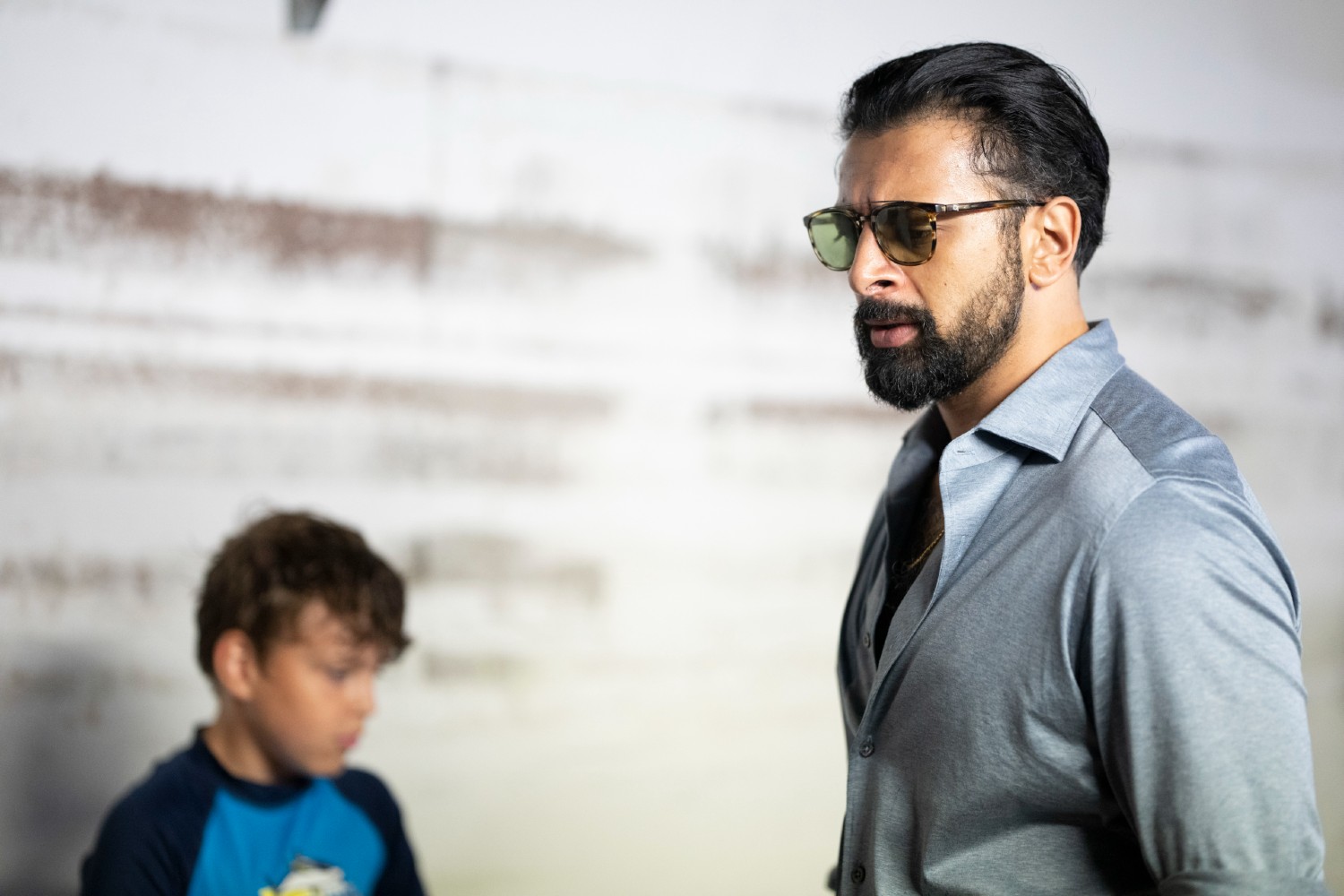 Chinar wearing sunglasses in Crossfire