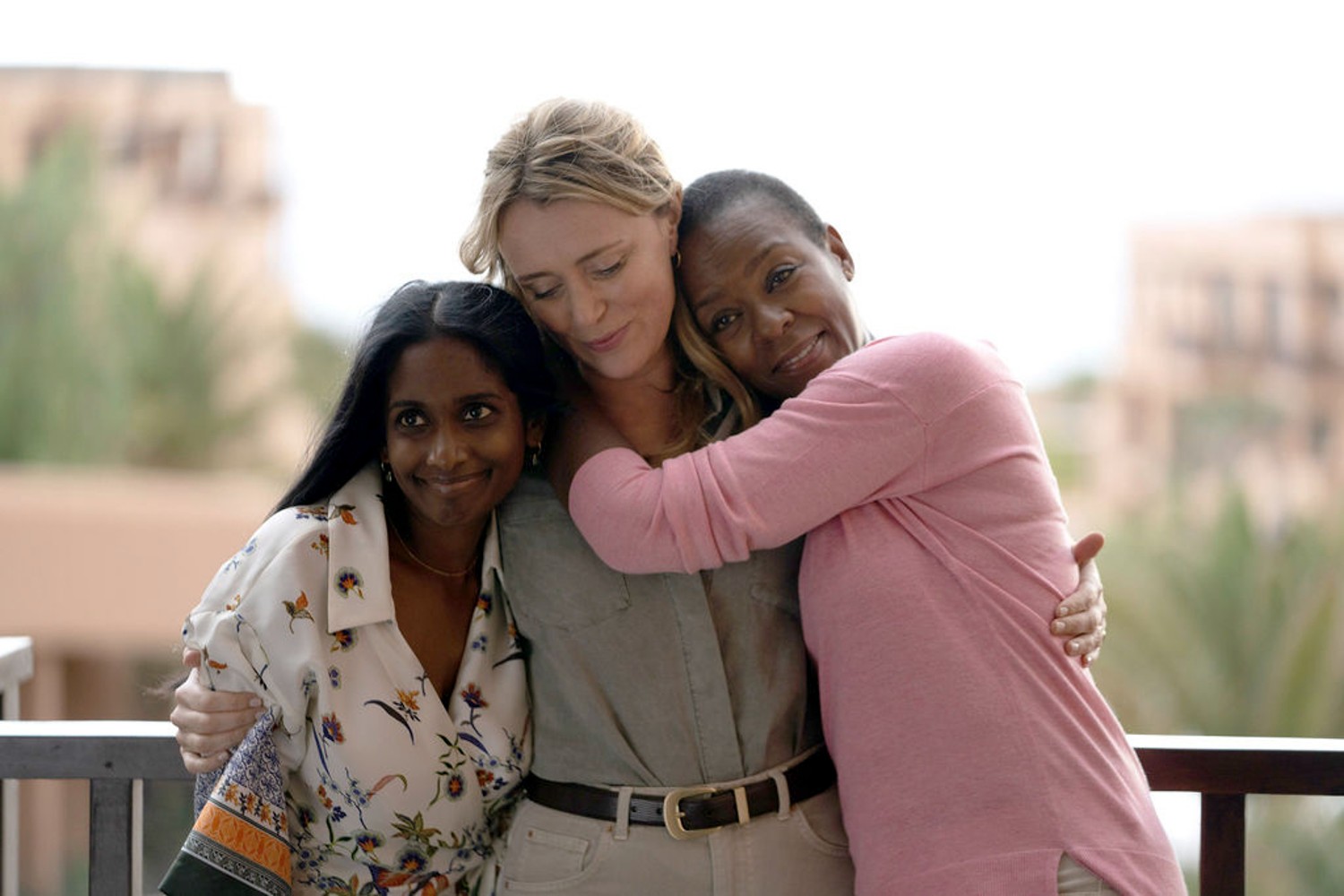 Abhi, Jo and Miriam hugging in Crossfire