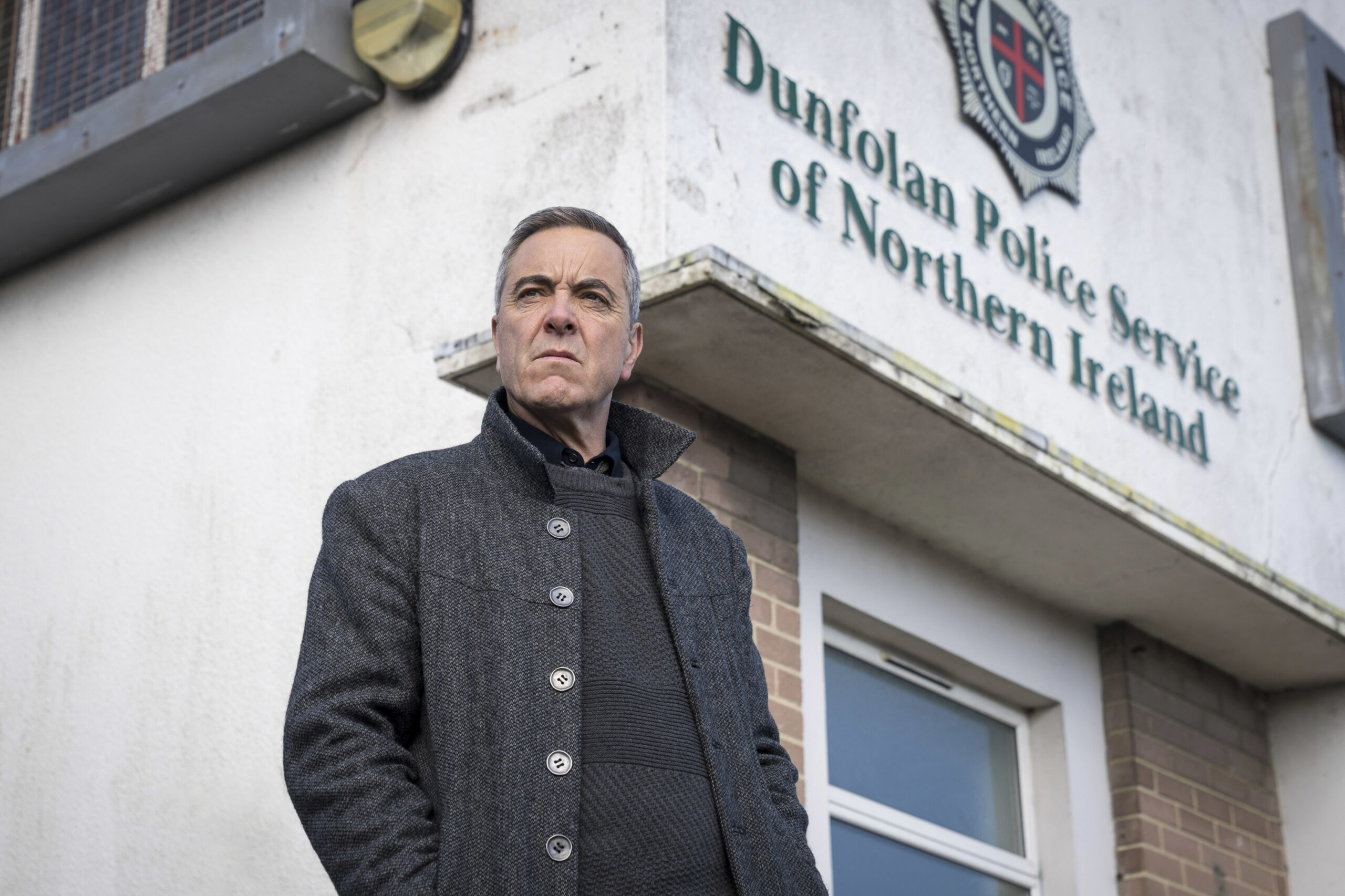 James Nesbitt as Tom Brannick in Bloodlands, he looks out outside the dunfolan police station
