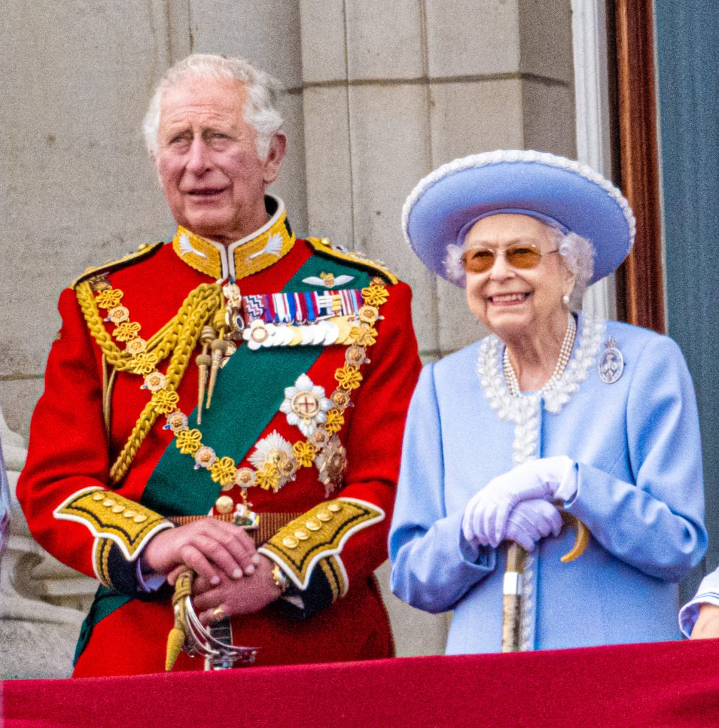 Queen Elizabeth II stands with King Charles on Buckingham Palace balcony