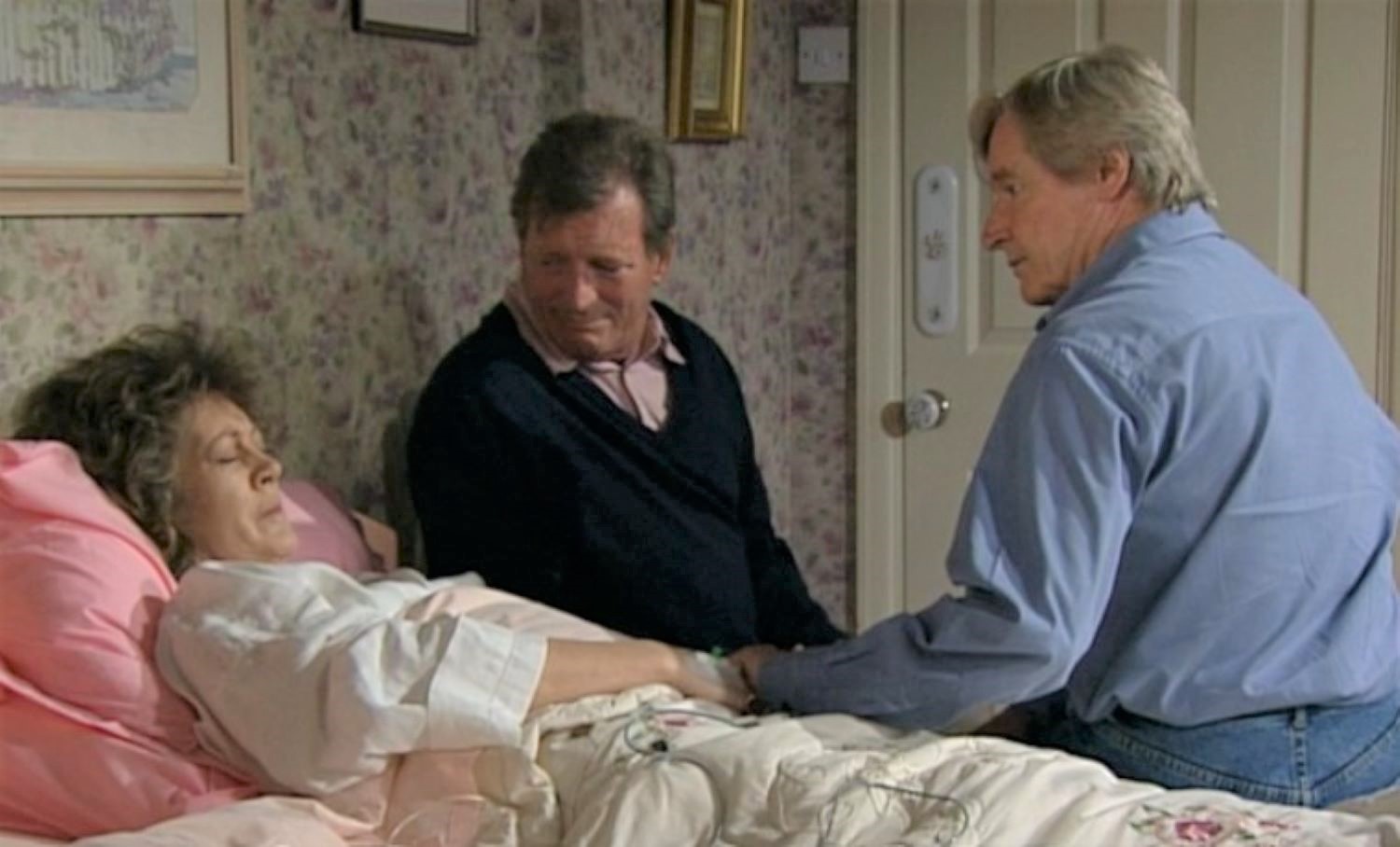 Coronation street Mike and Ken sit by Alma's bedside