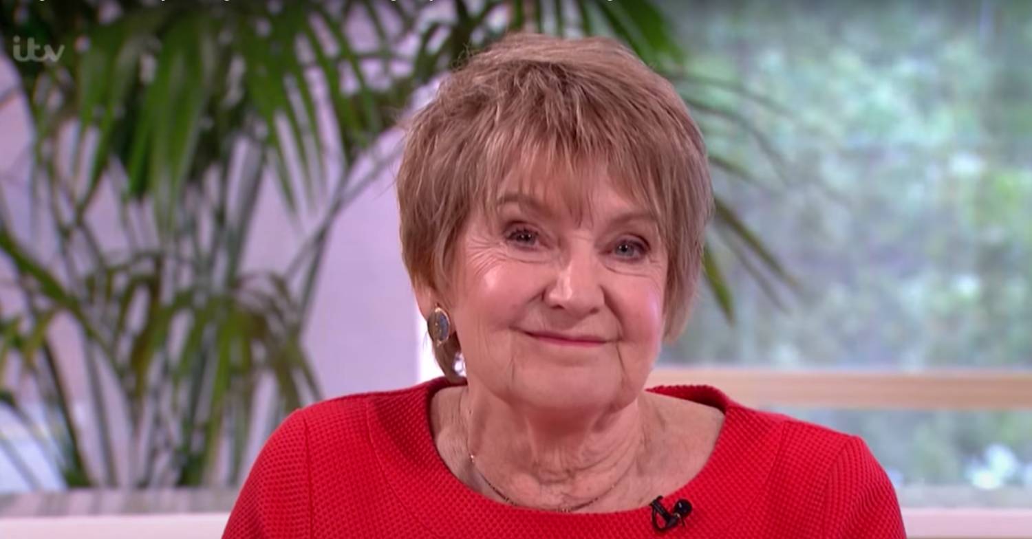 Deirdre Sanders smiles to the camera