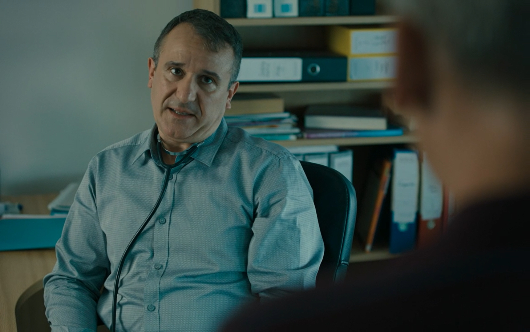 Daniel Cerqueira as Dr Graves in The A Word, he looks up to his patient in his GP office