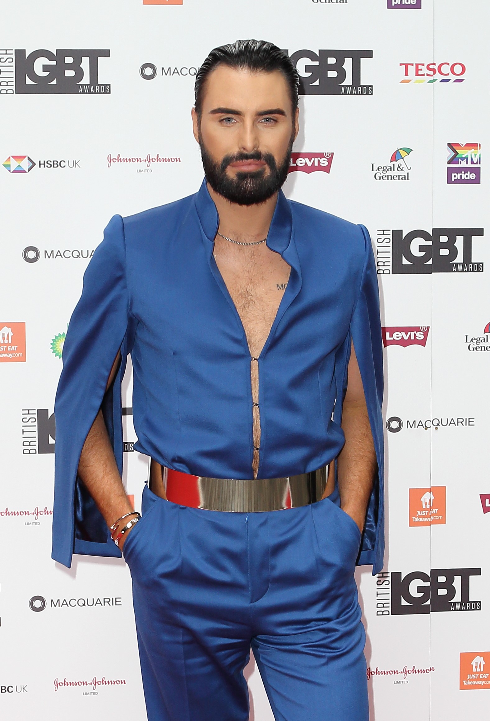 Rylan Clark smiles in blue suit at awards