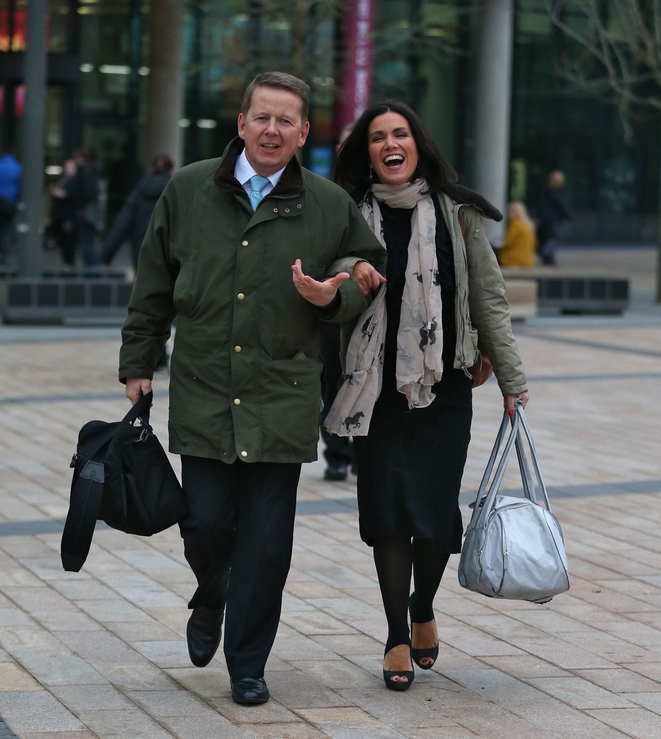 BBC star Bill Turnbull and Susanna Reid walking arm in arm laughing