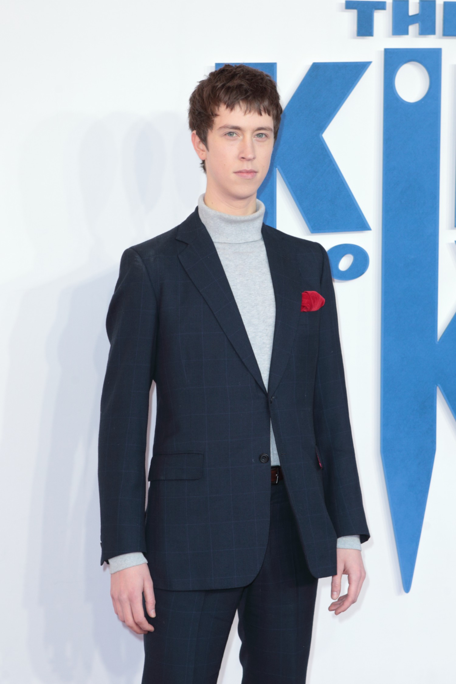 Angus Imrie standing on the red carpet 
