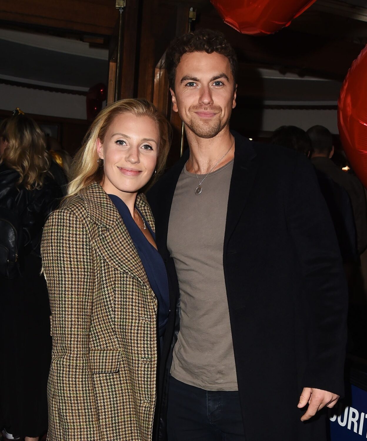 Richard Fleeshman and Celinde Schoenmaker smile at theatre celebration