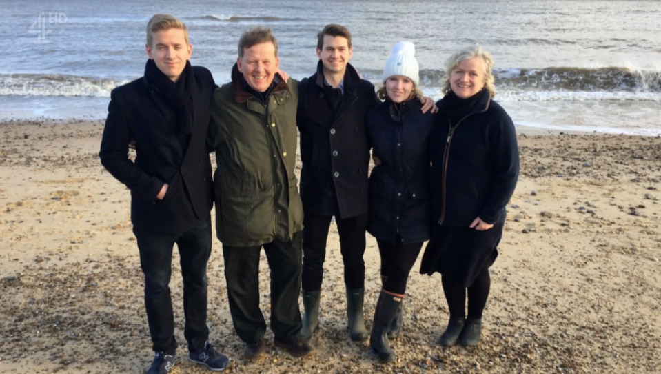 Bill Turnbull poses on the beach with his family