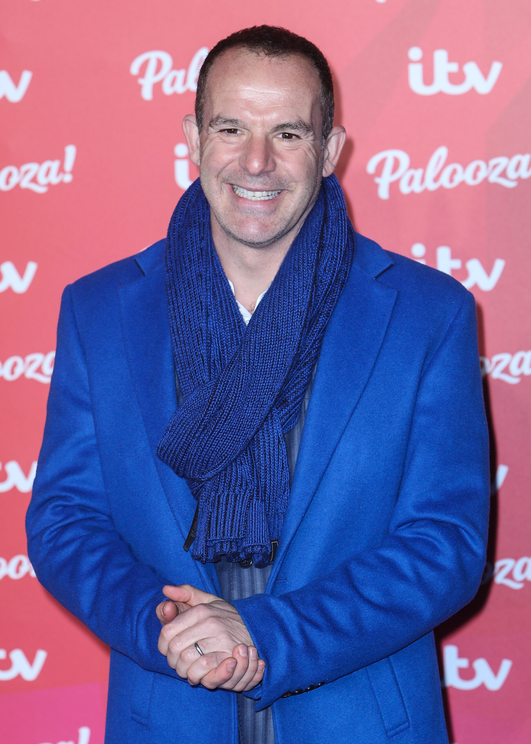 Money expert Martin Lewis wearing a blue coat and scarf