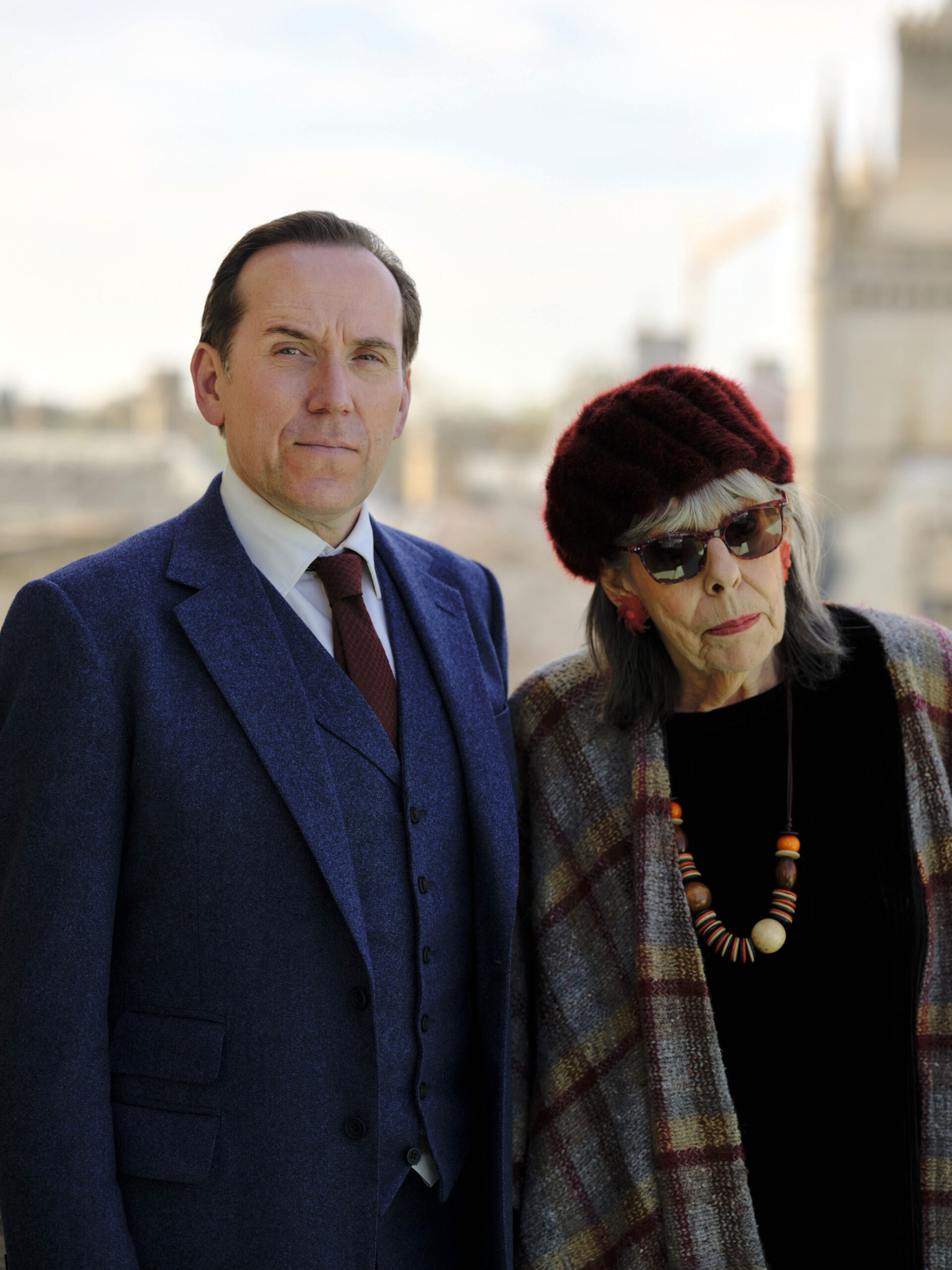 Ben Miller as Professor T (left) and Francis de la Tour (right) they stand of the roof in fancy clothing, close to each other they look into the camera