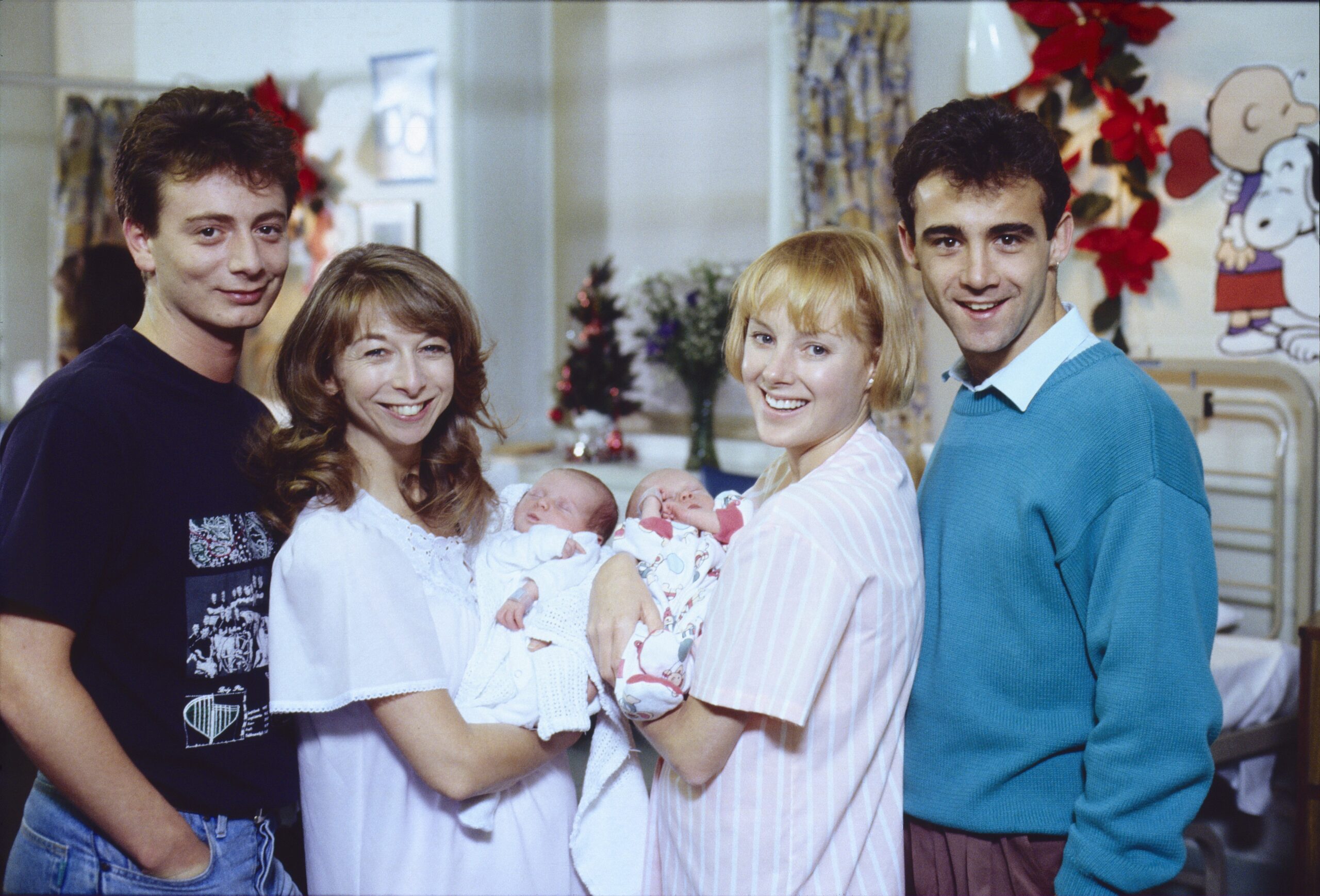 Sally and Gail show off babies Rosie and David with husbands Martin and Kevin