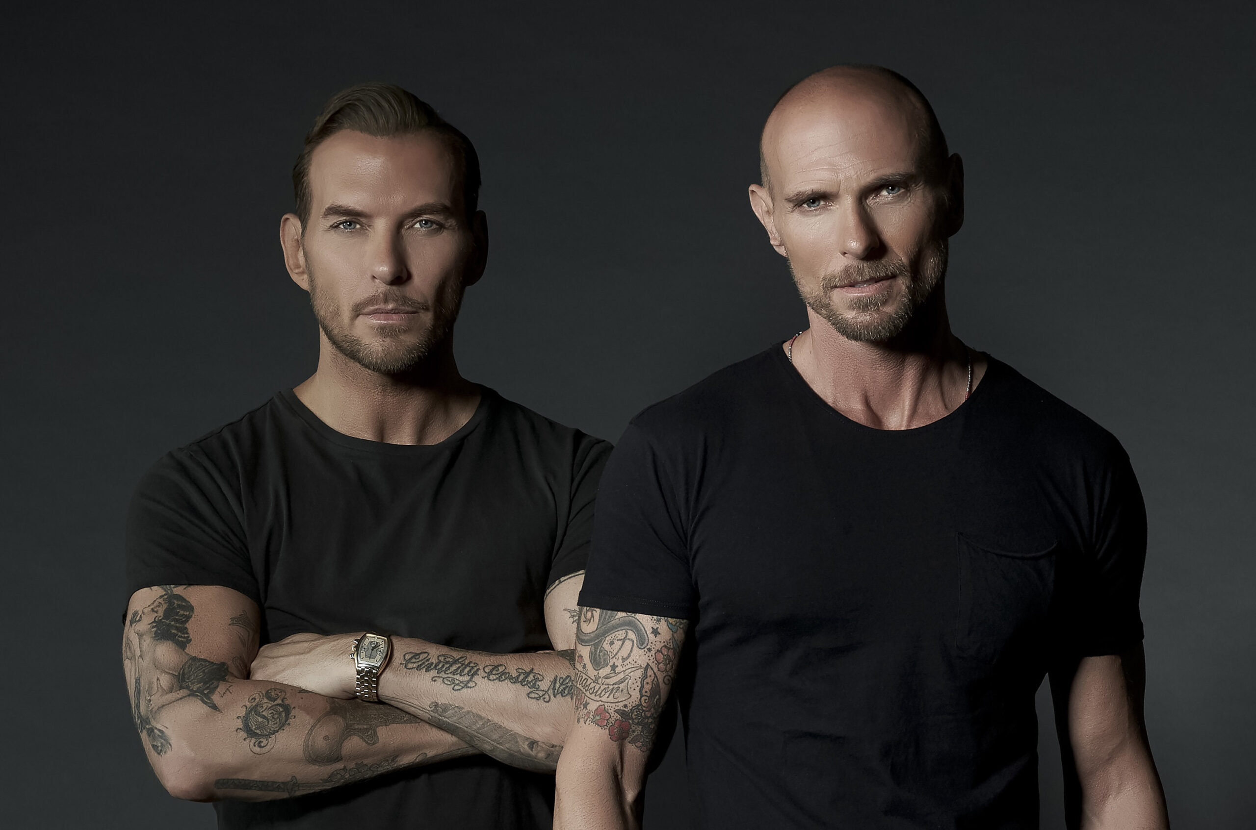 Matt Goss and his brother Luke look moody in black t'shirts