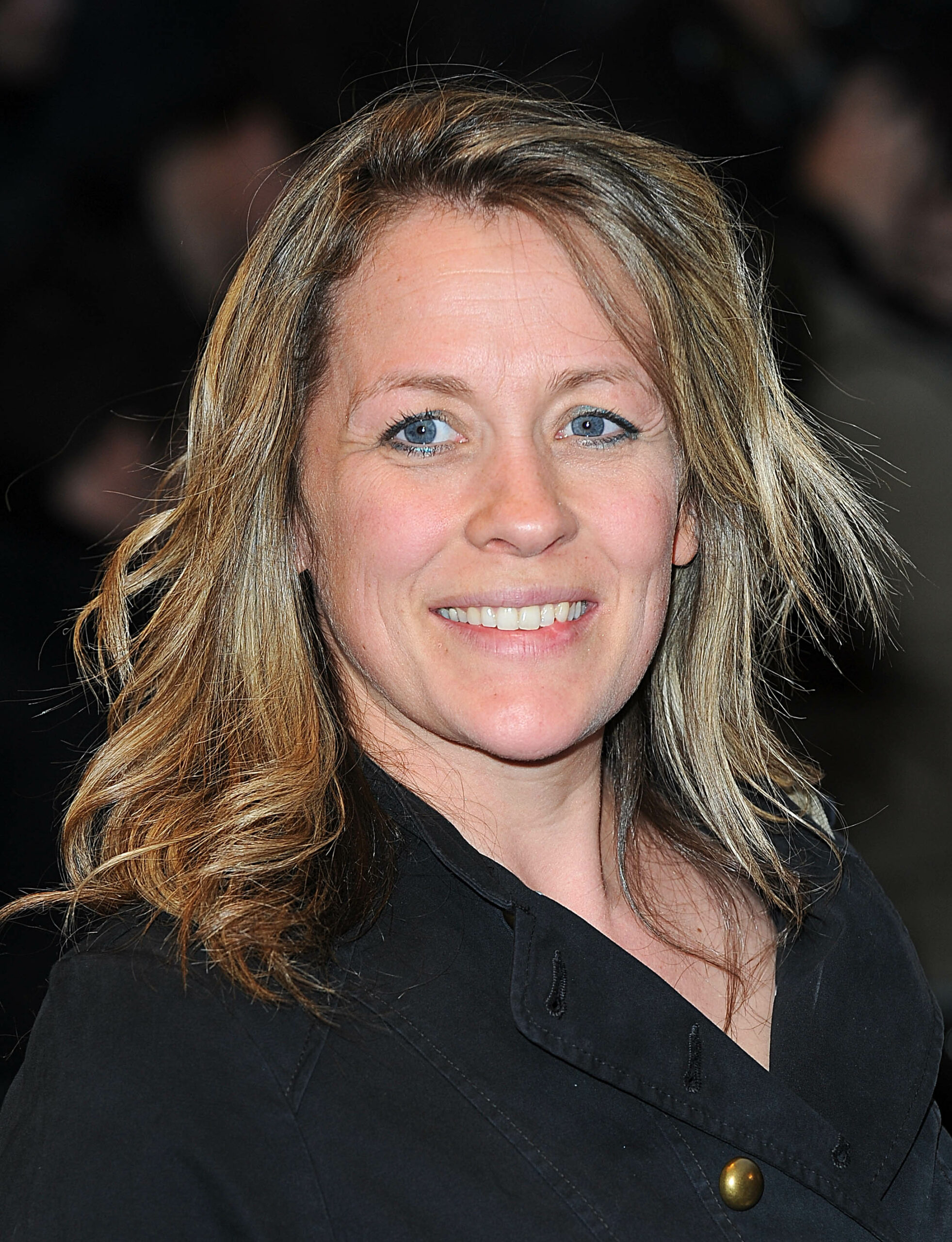 Sarah Beeny smiling at a movie premiere