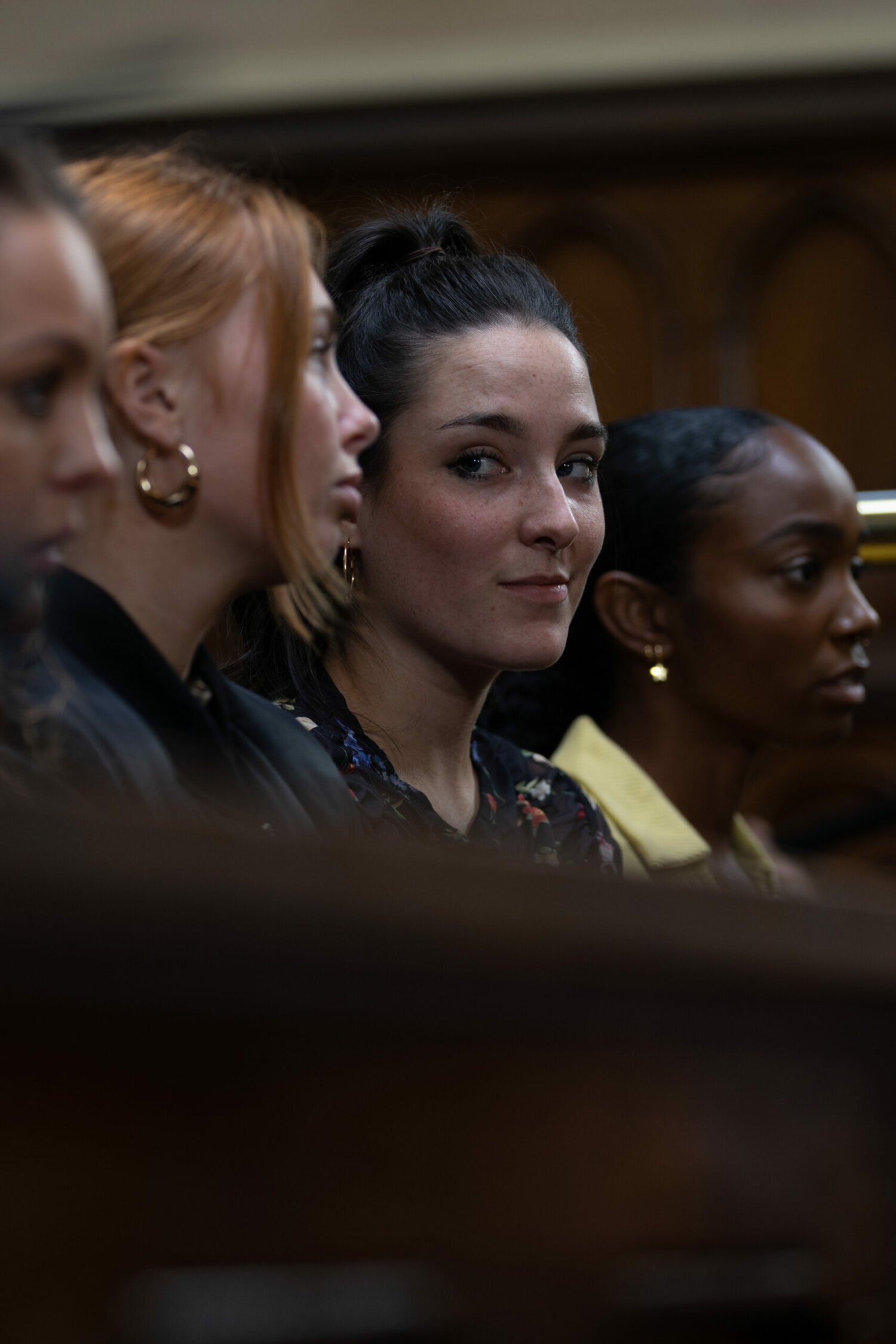Naomi and Saskia, sitting next to two other gang members in courtoom