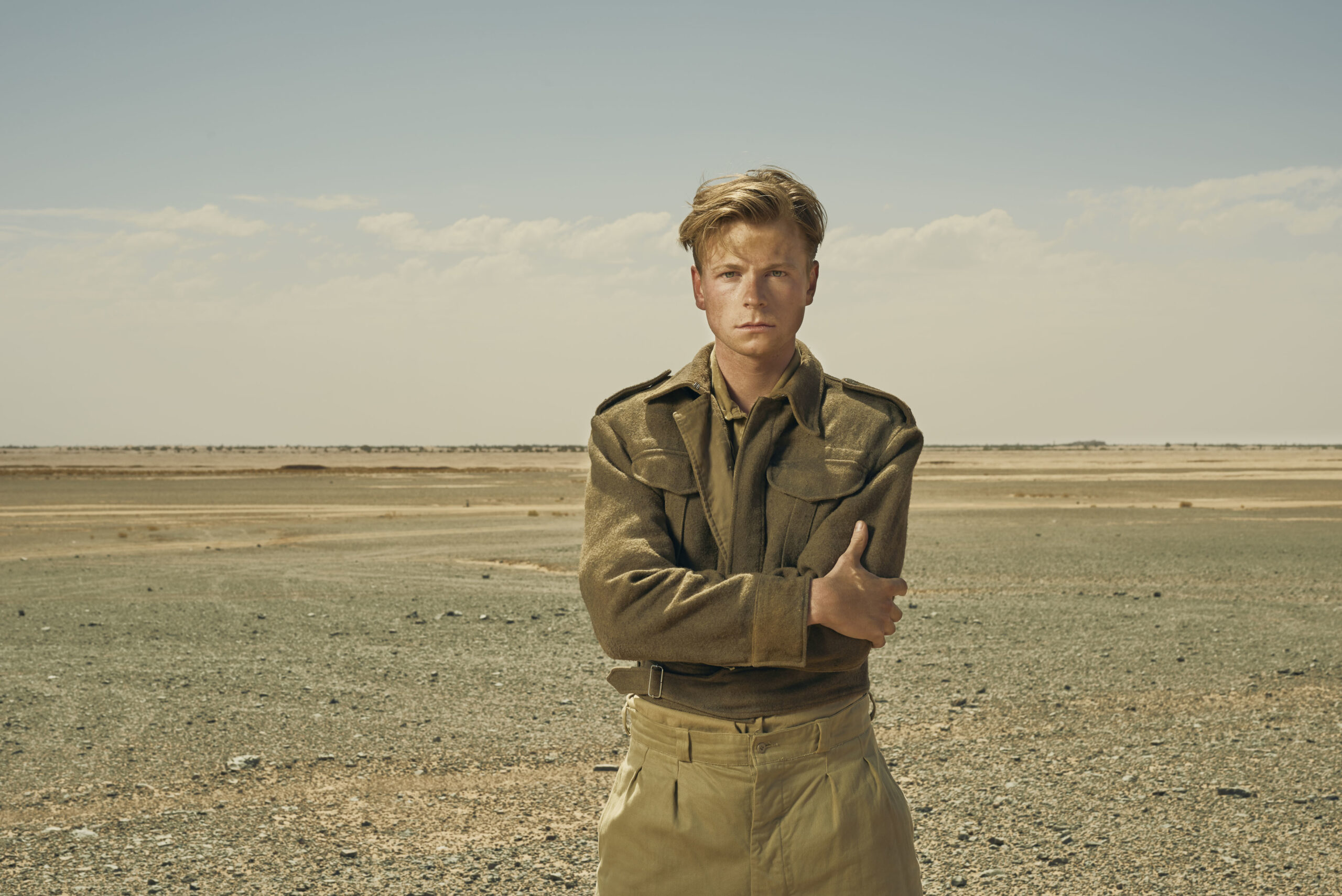 Bill Fraser standing in the desert in SAS Rogue Heroes