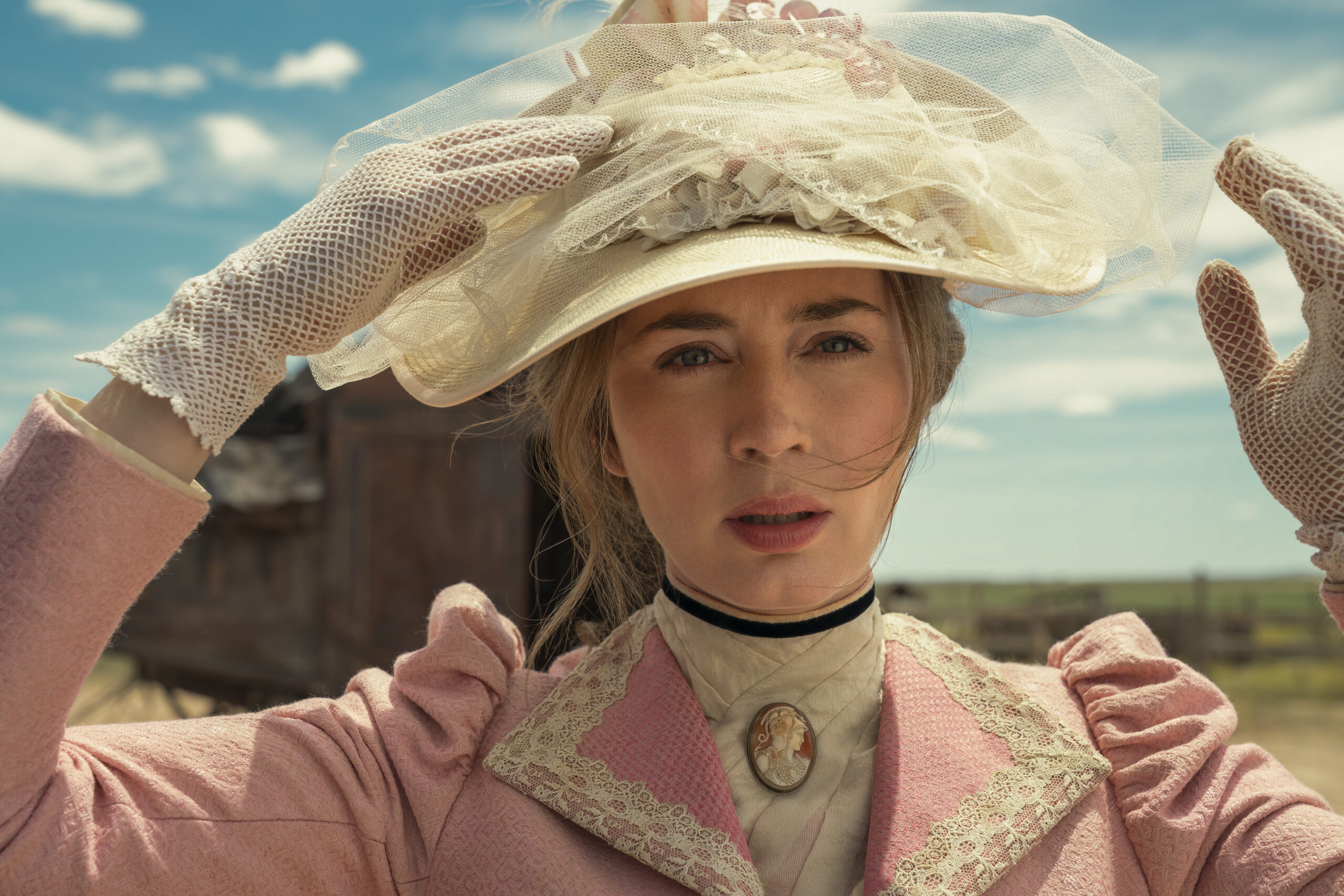 Cornelia Locke grabs her hat in The English
