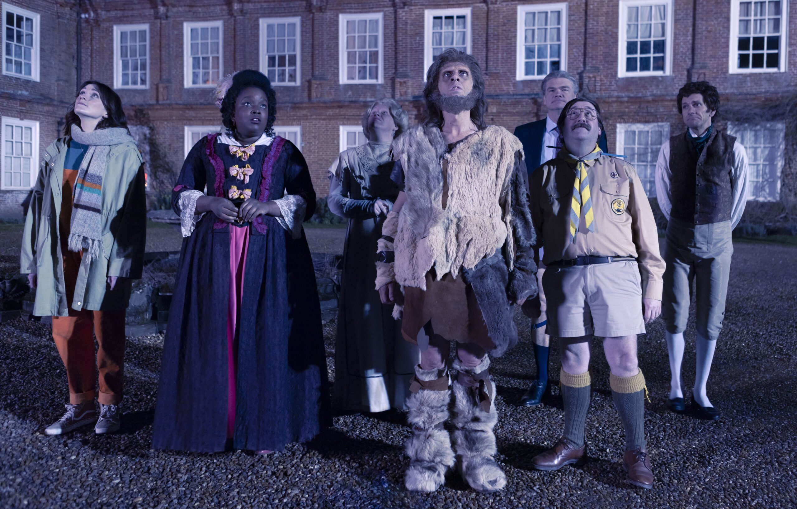 Ghosts Christmas special 2022 Alison (CHARLOTTE RITCHIE), Kitty (LOLLY ADEFOPE), Lady Button (MARTHA HOWE- DOUGLAS), Robin (LARRY RICKARD), Julian (SIMON FARNABY), Pat (JIM HOWICK), Thomas Thorne (MAT BAYNTON) in Ghosts, they stand outside Button House, looking up at the sky