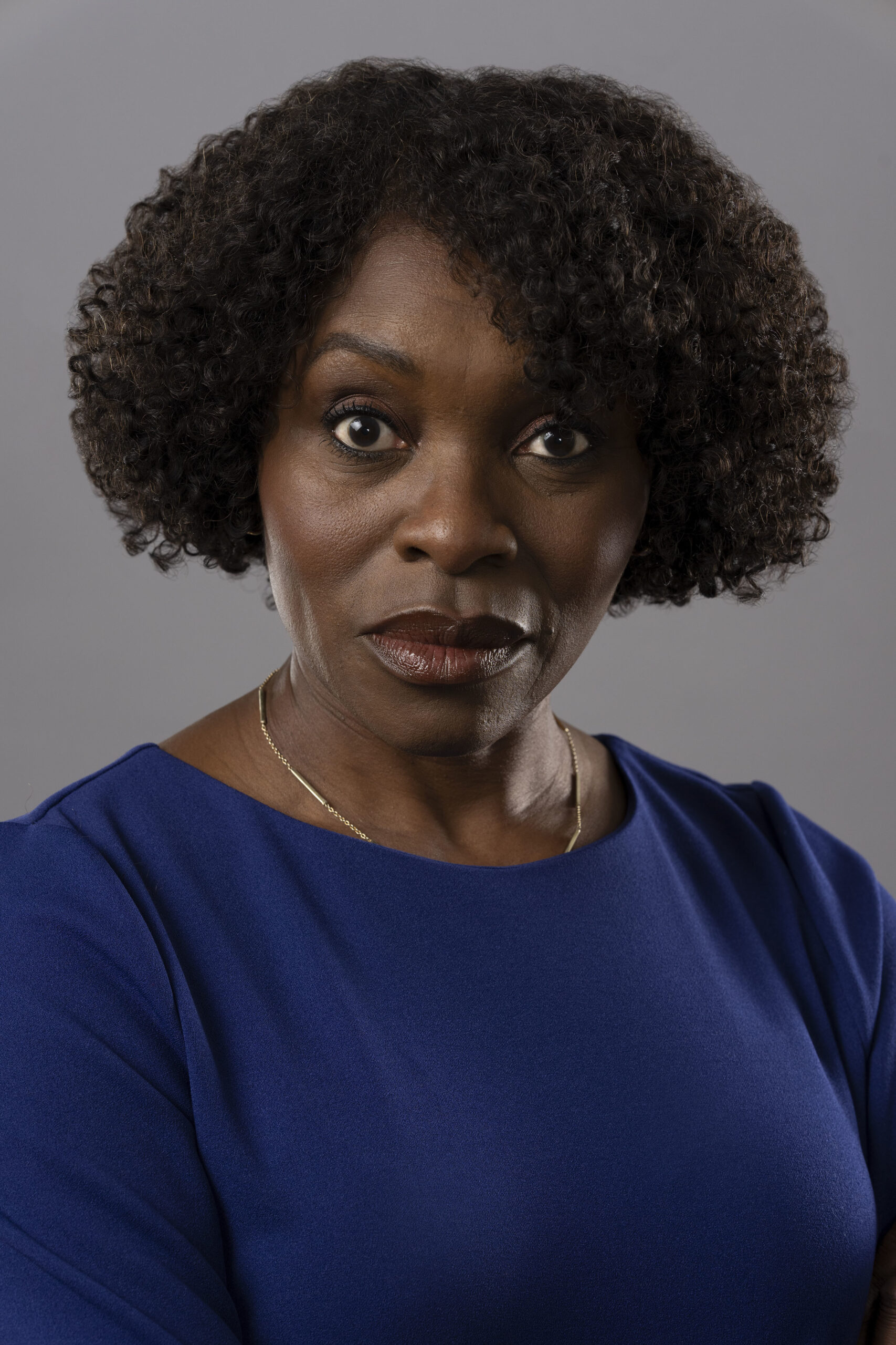 Headshot of Rakie Ayola as Christine in The Pact series 2 in blue dress
