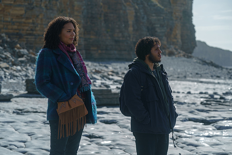 Mali Ann Rees and Jordan Wilks on a beach in South Wales looking out to sea