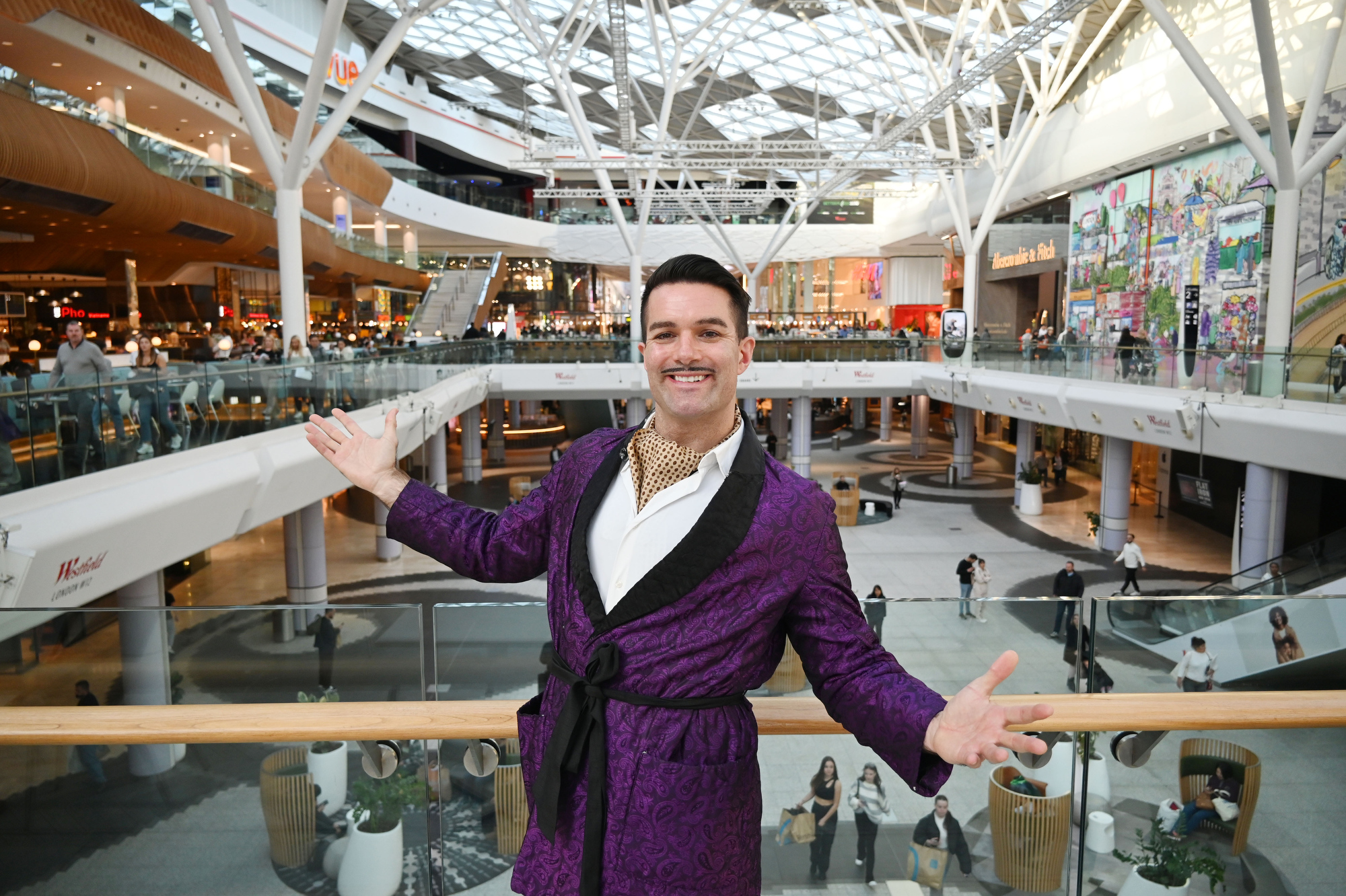 Man with moustache chatting at Westfield