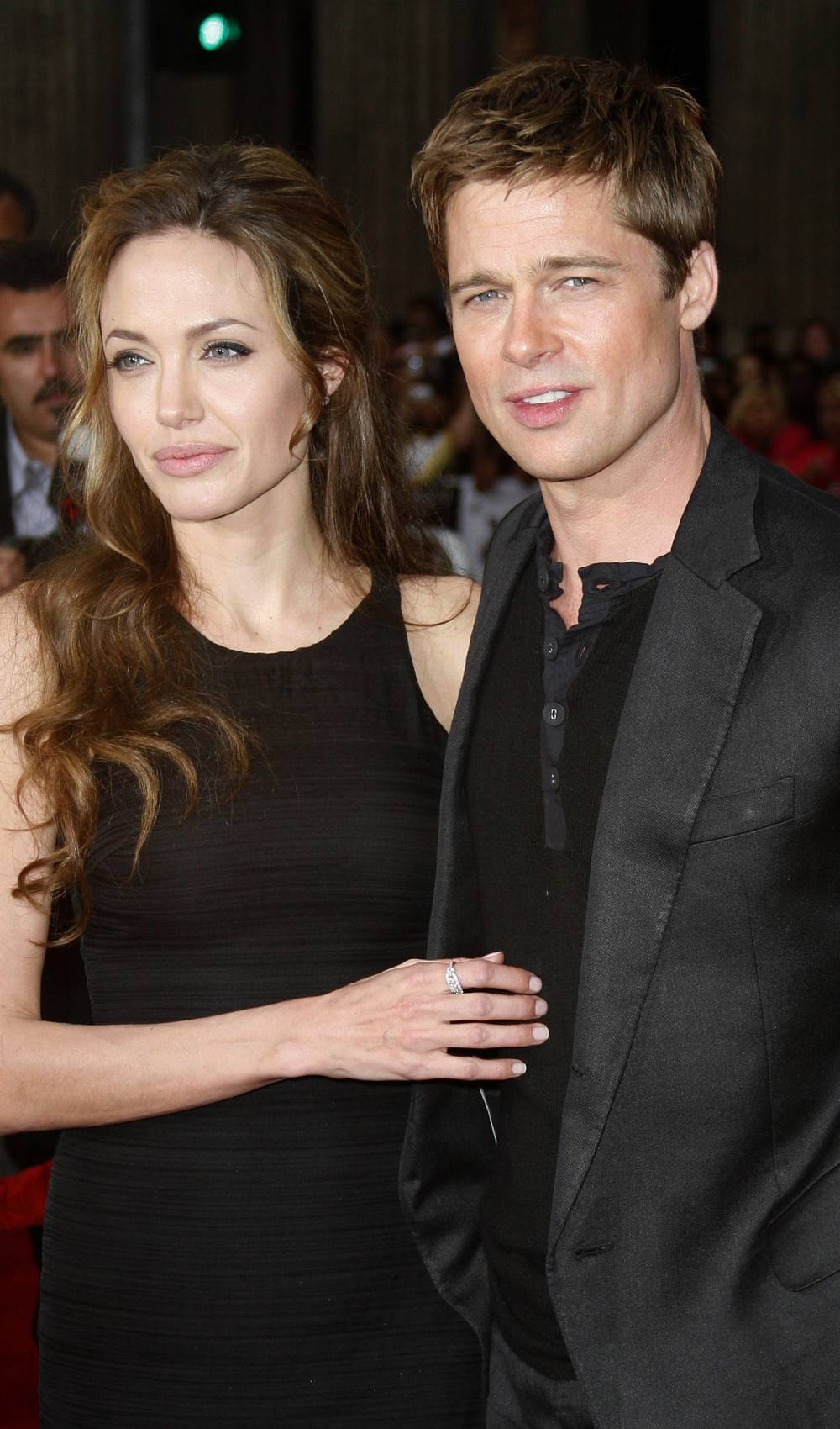 Angelina Jolie and Brad Pitt stand together in 2006