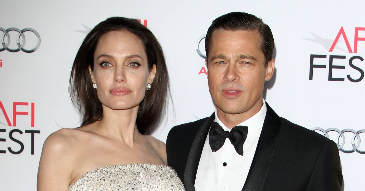 Angelina Jolie and Brad Pitt pose for cameras