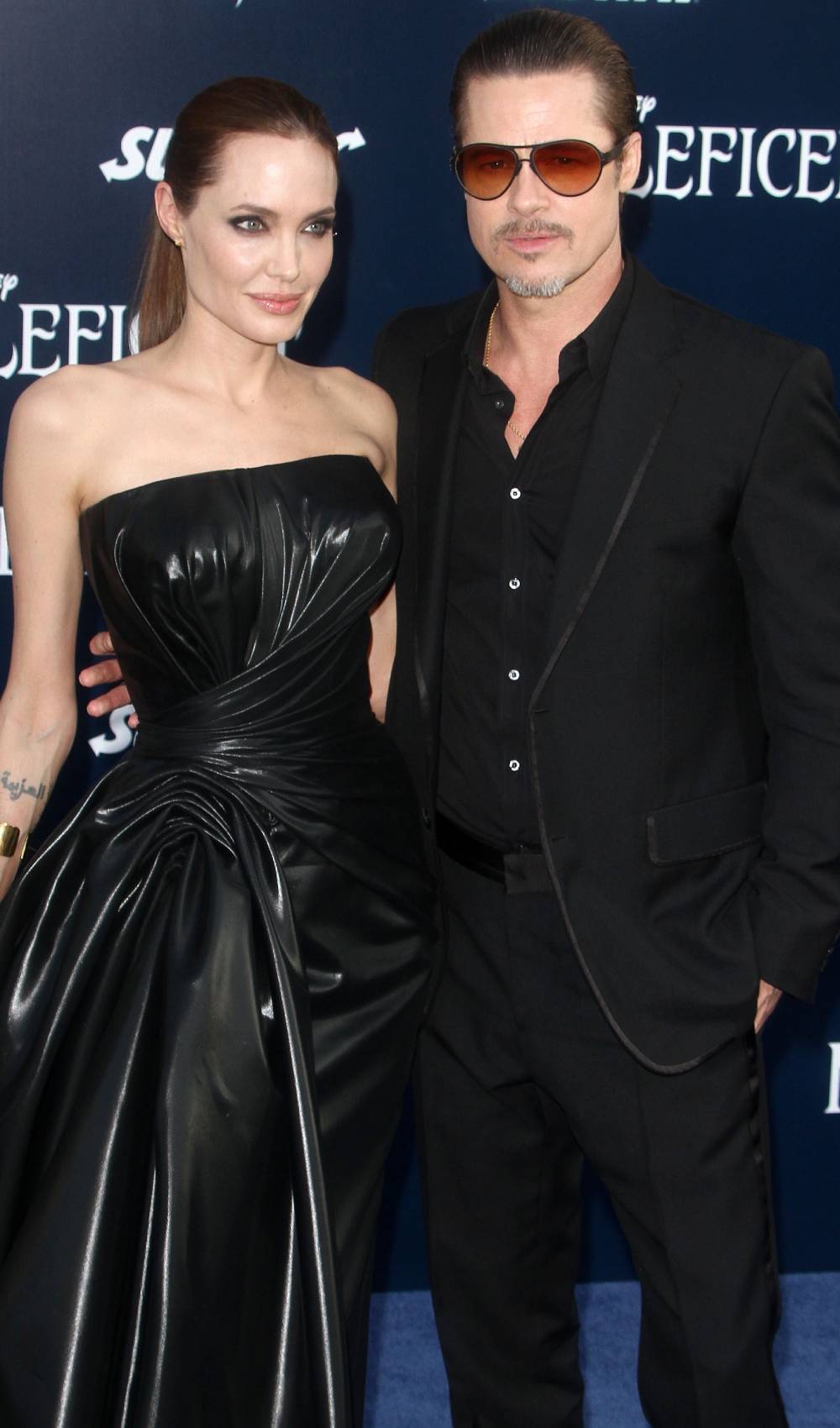Angelina Jolie and Brad Pitt look in different directions