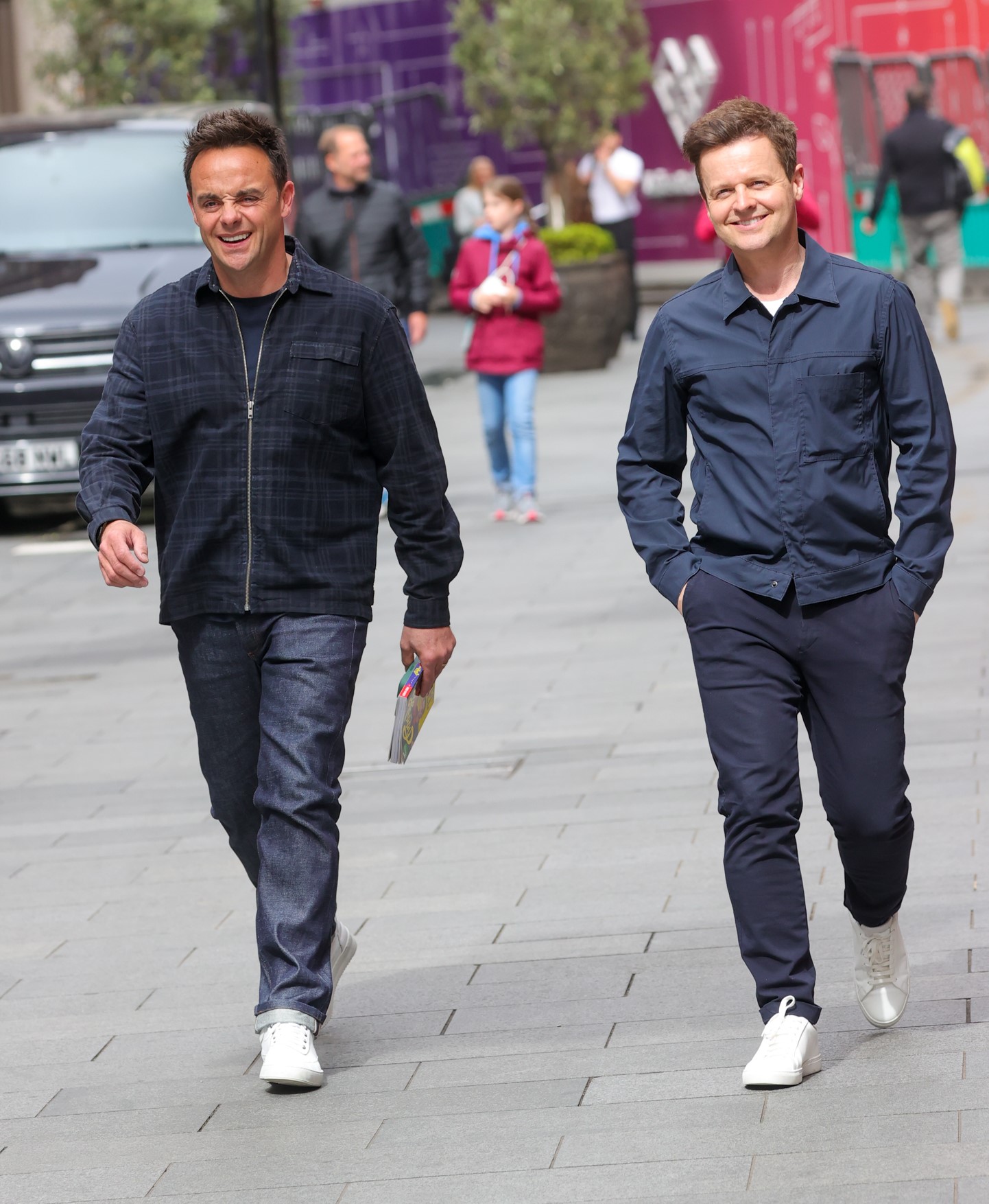 Ant McPartlin and Dec Donnelly smiling while walking outside