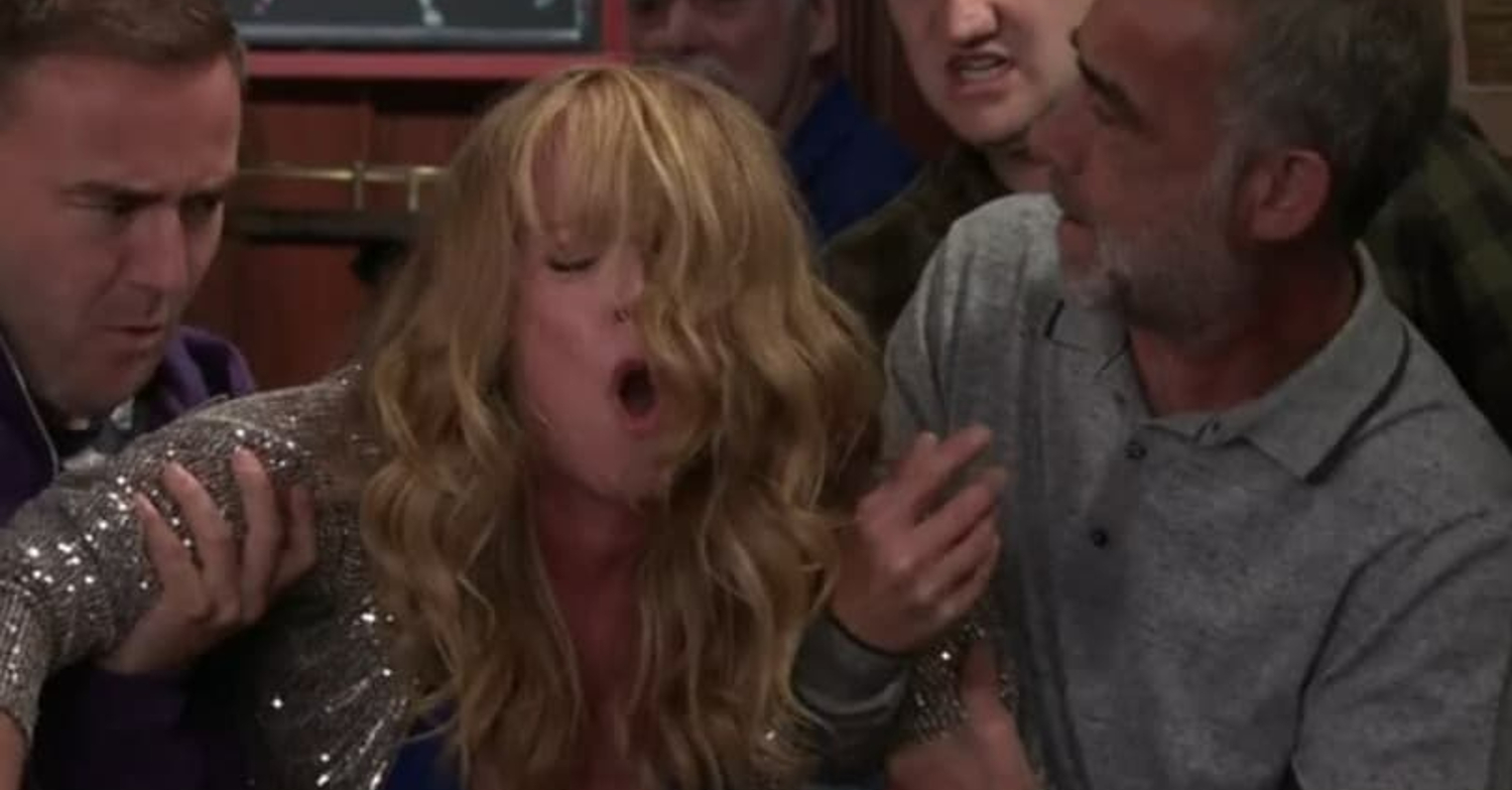 Coronation Street Jenny in pain being held up by Tyrone and Kevin