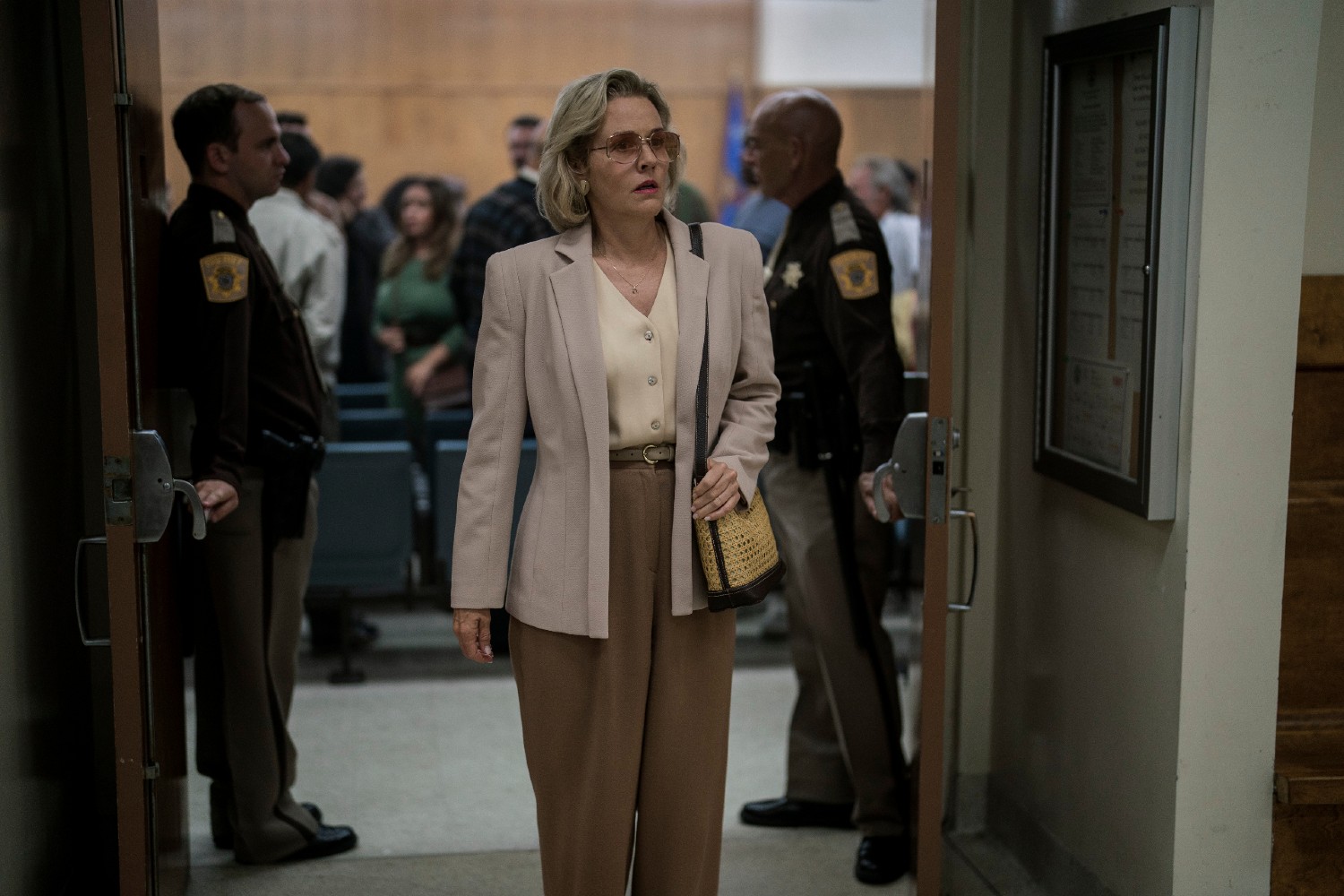 Penelope Ann Miller wearing sunglasses in Monster: The Jeffrey Dahmer Story