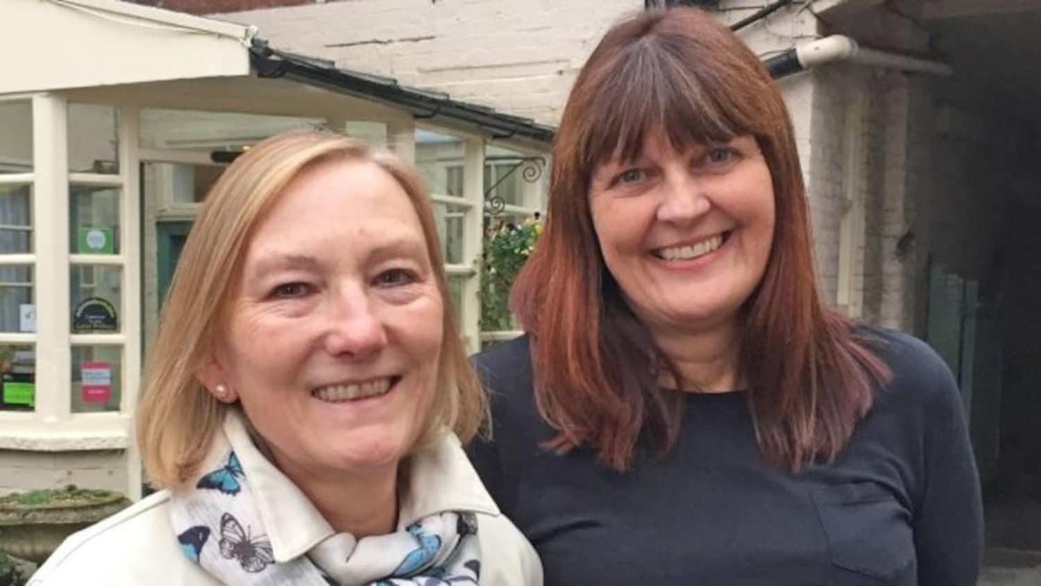 Denise and Jackie smiling in Four in a Bed
