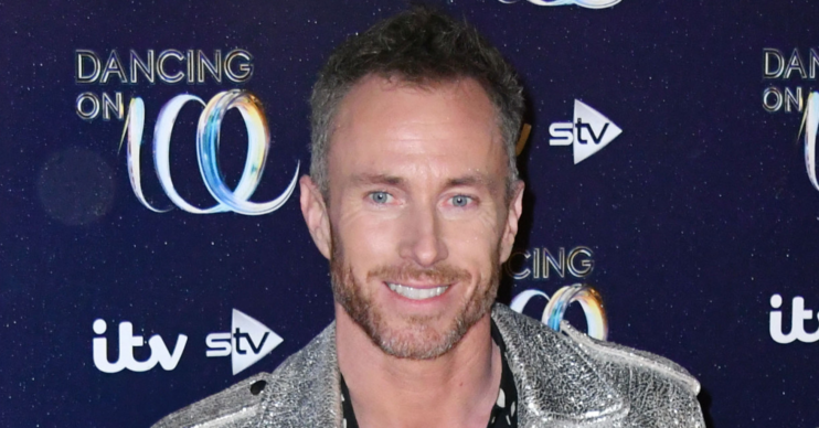 James Jordan on the red carpet smiling